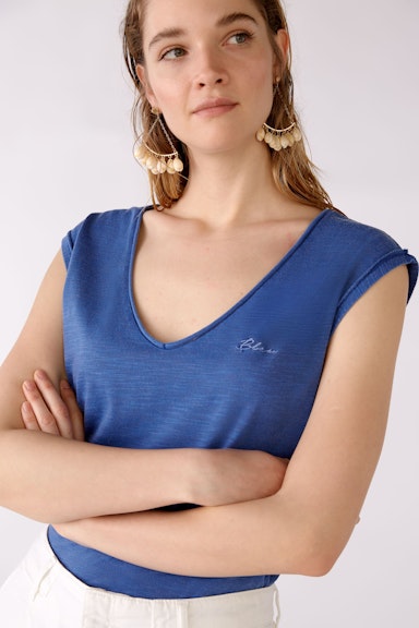 Top with small embroidery