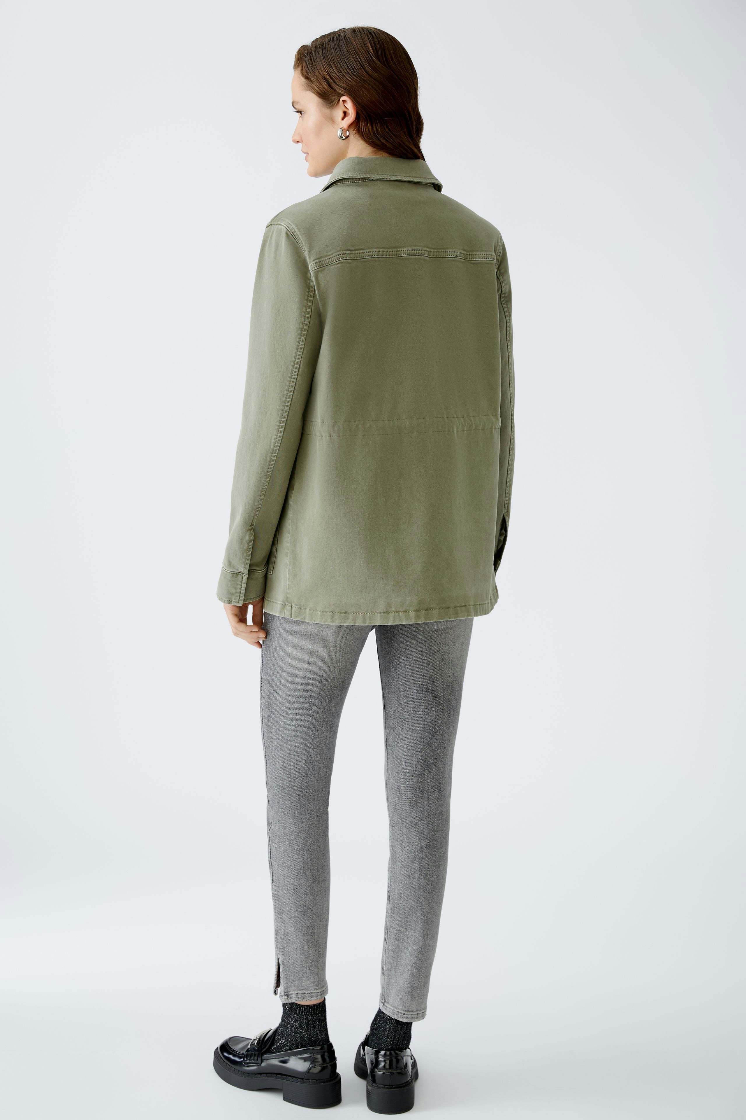 Stylish women's field jacket in olive green, perfect for casual outings and layering.