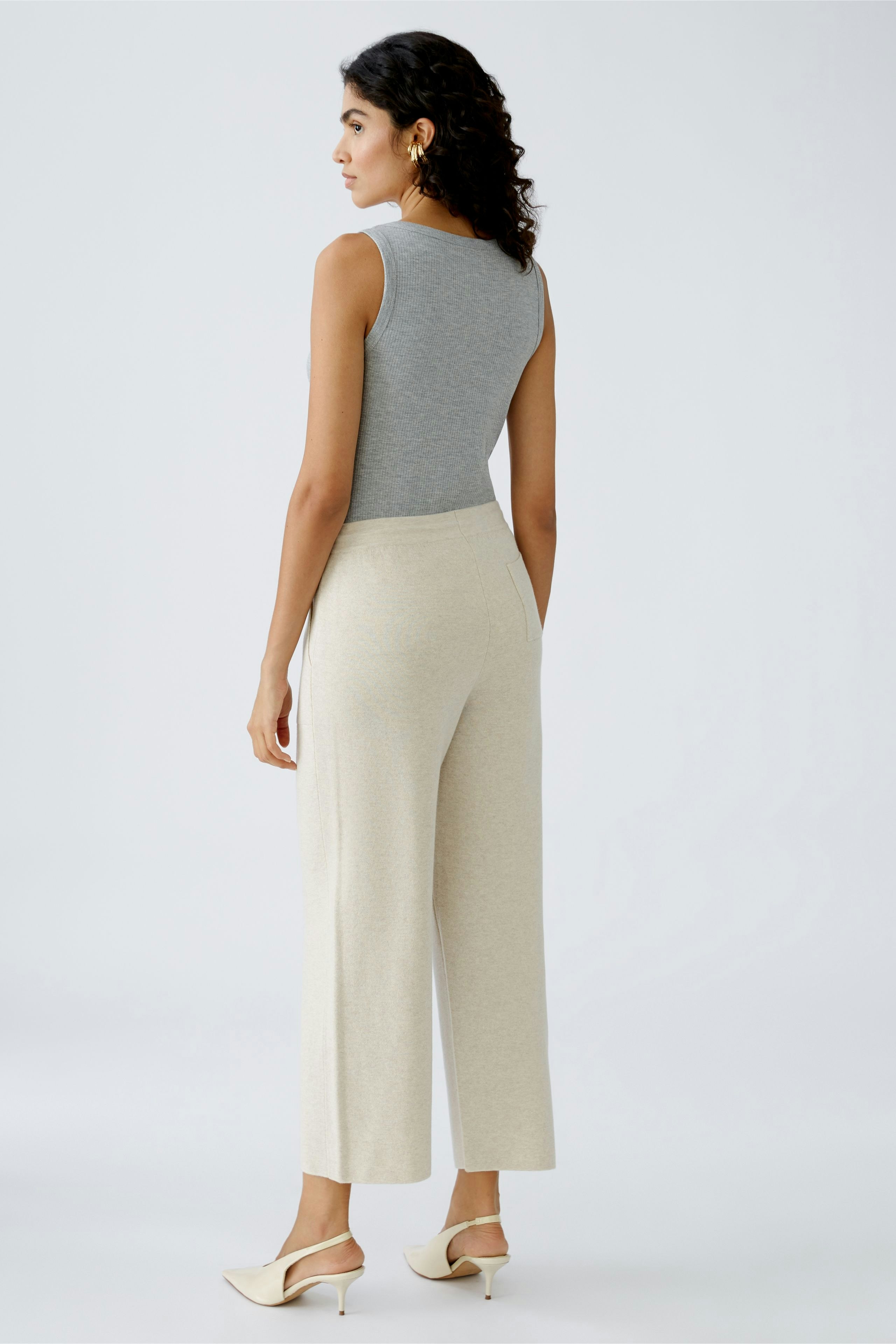 Elegant women's knit pants in a light color, offering comfort and style for any occasion.