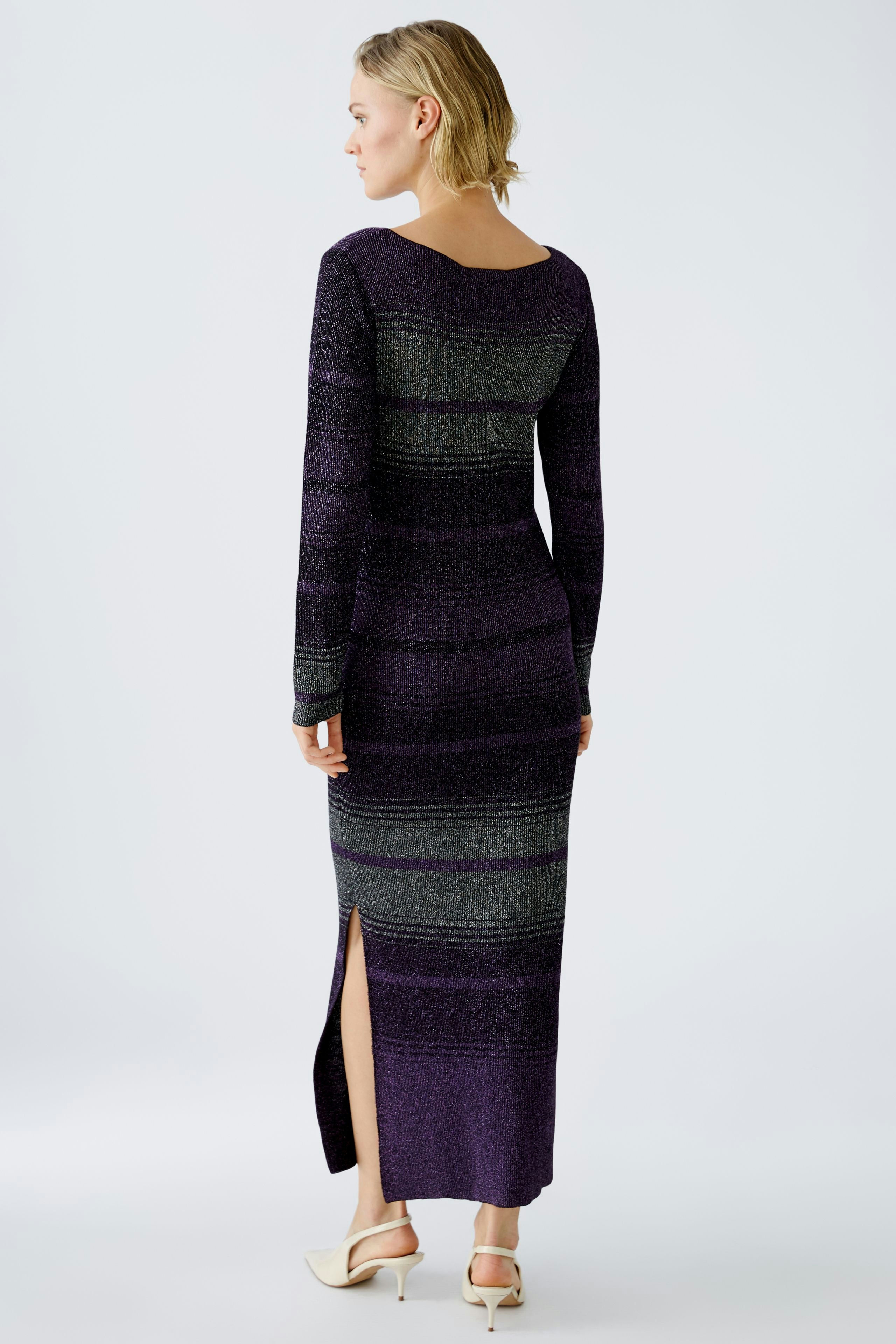 Elegant women's knitted dress with long sleeves and side slit, showcasing a stylish striped pattern.