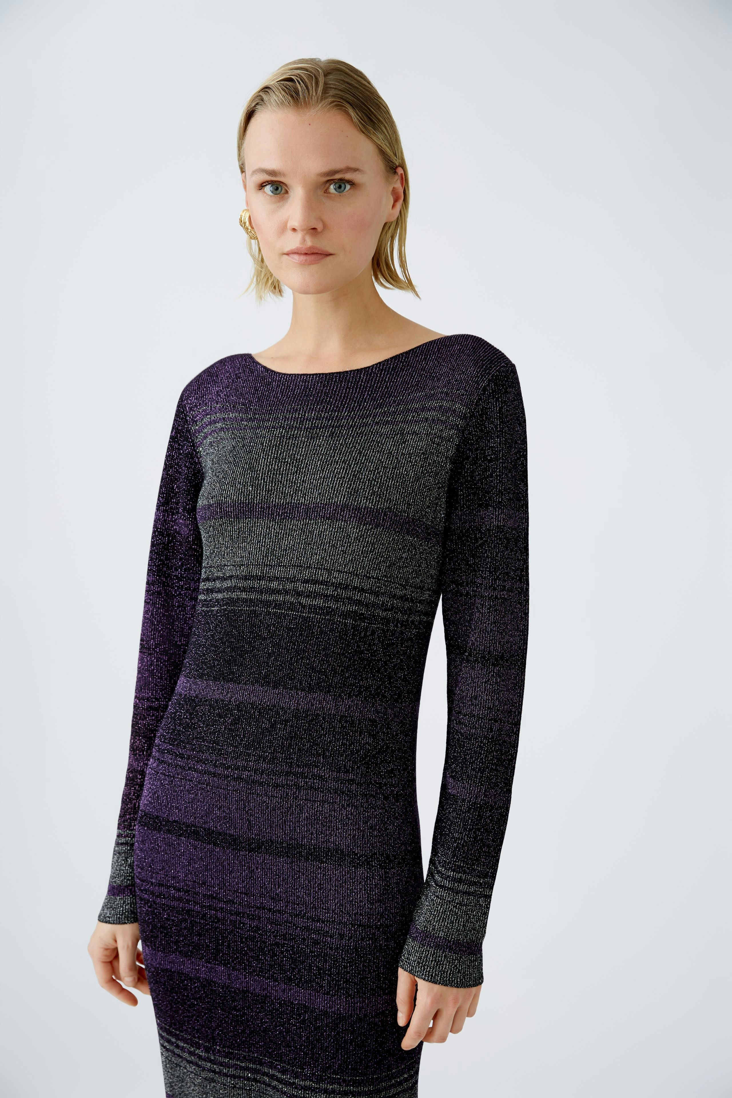 Elegant women's knitted dress in purple and gray stripes, showcasing a fitted silhouette.