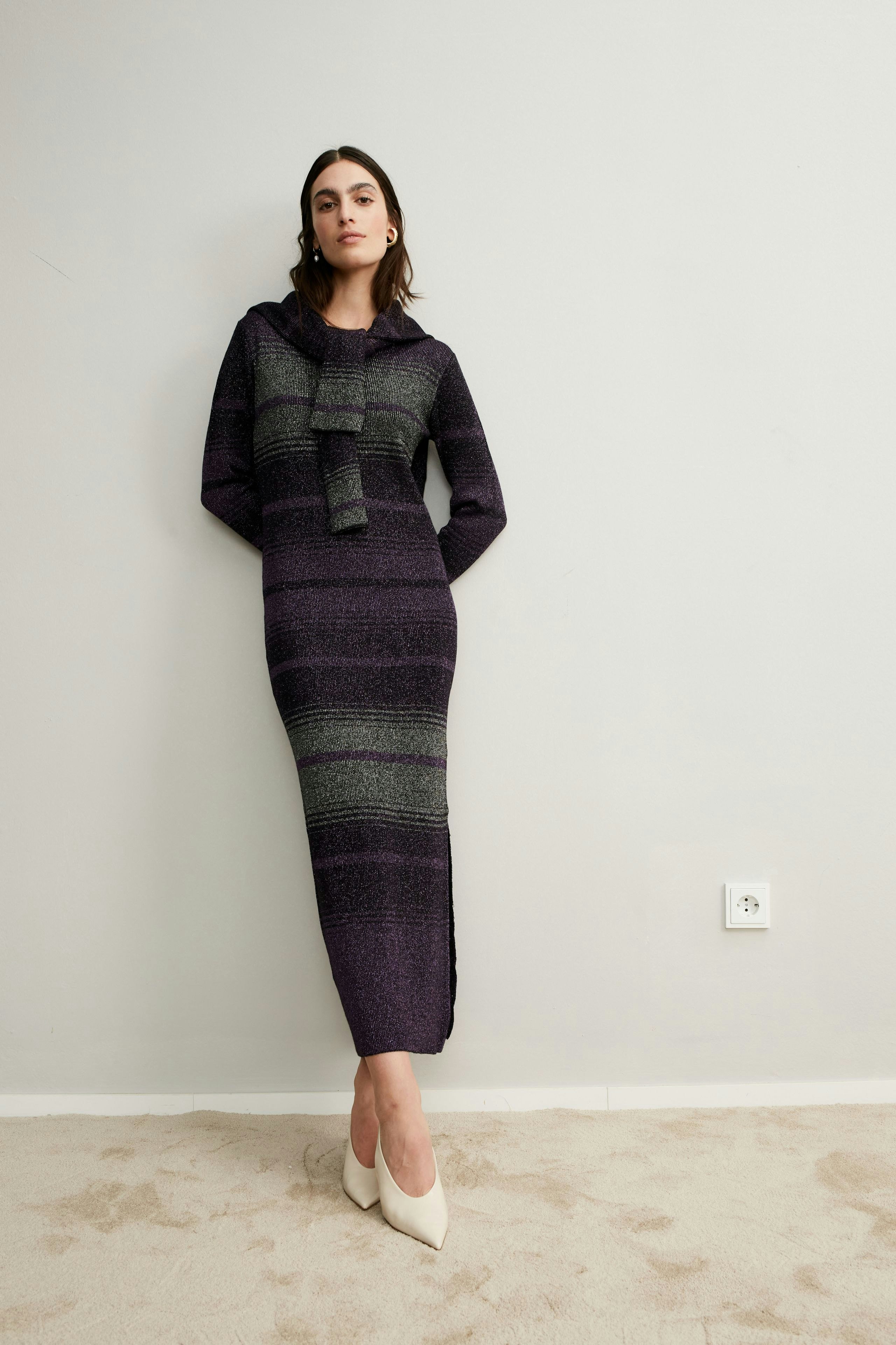 Elegant women's knitted dress in purple and green stripes, perfect for any occasion.