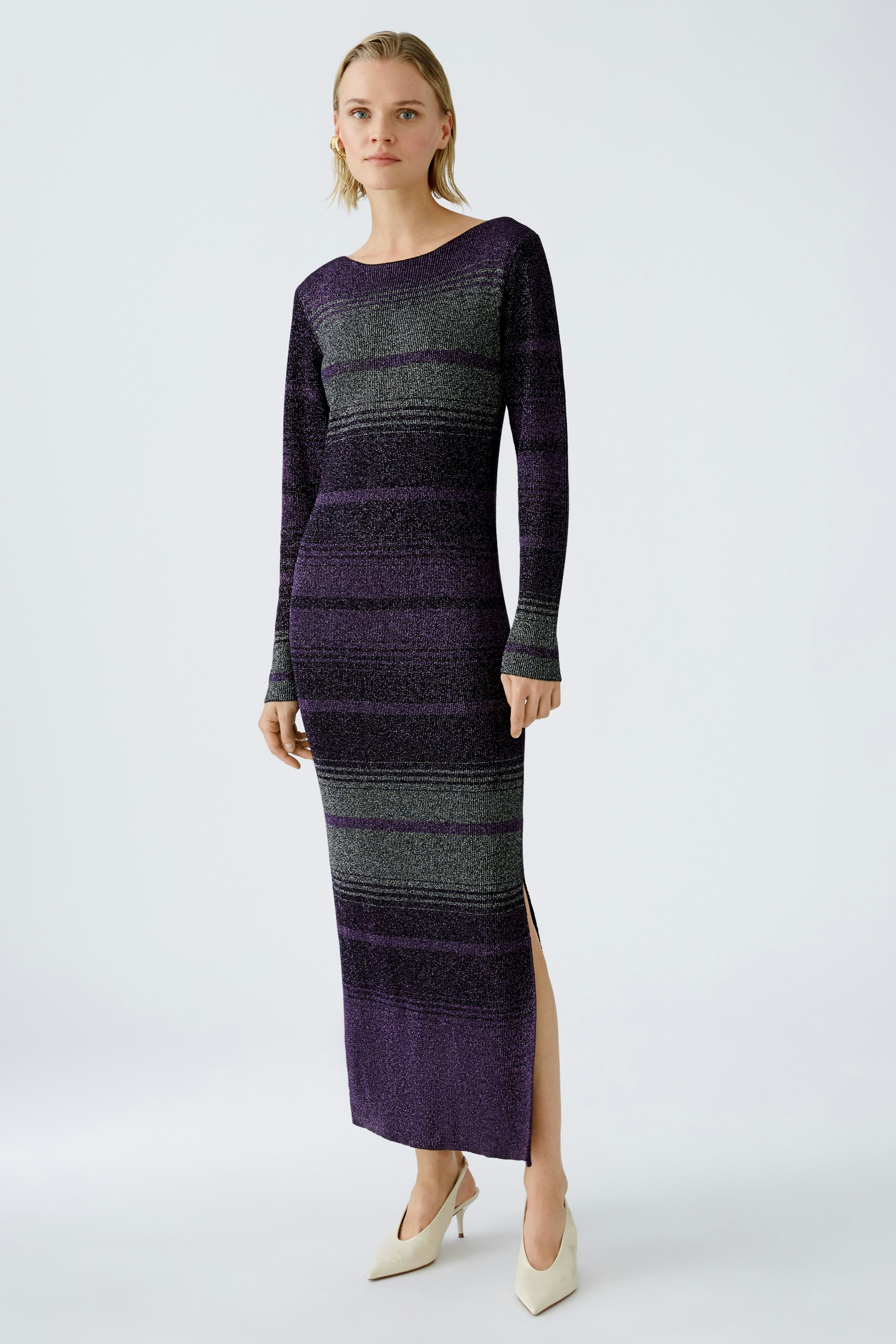 Elegant women's knitted dress in purple and green stripes, featuring a side slit for a modern touch.