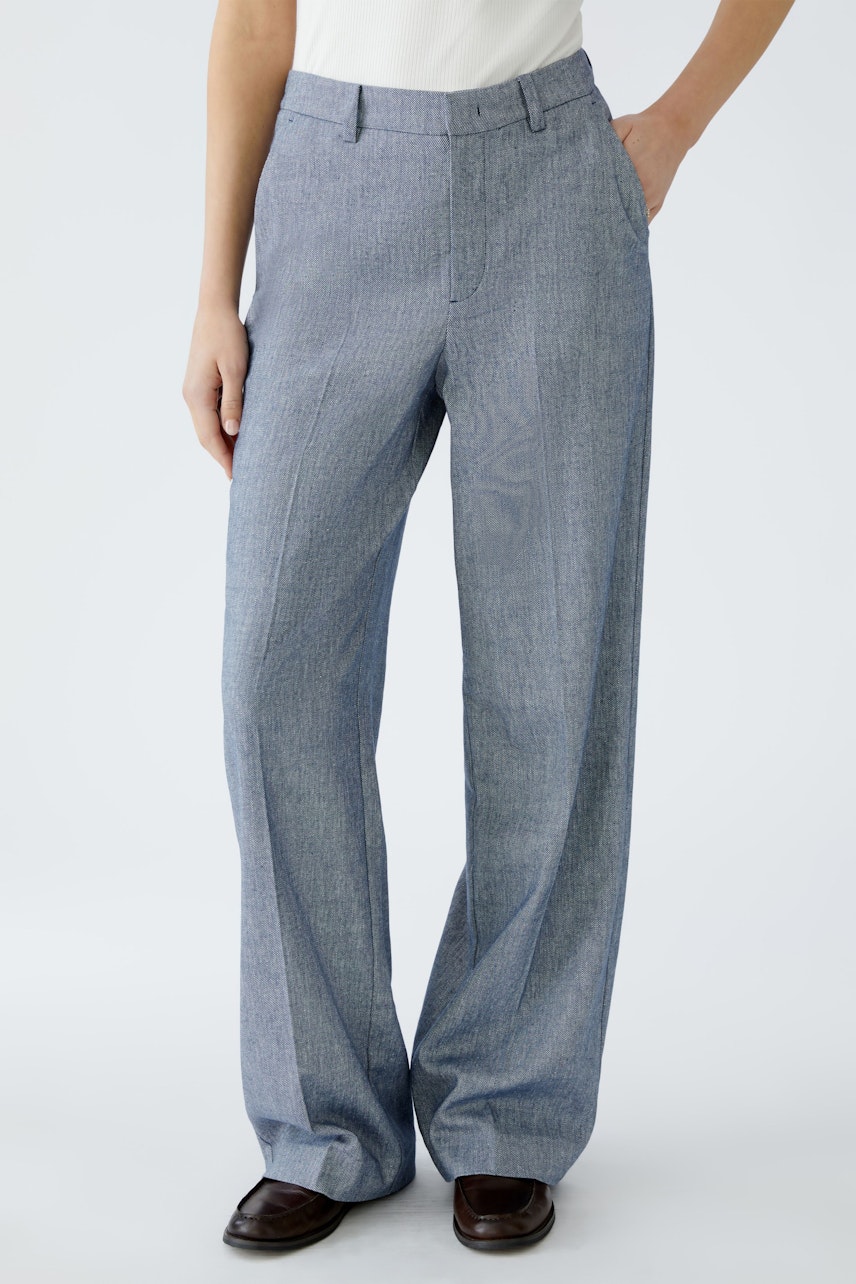 Stylish women's fabric trousers in a light blue hue, offering a modern and elegant fit.