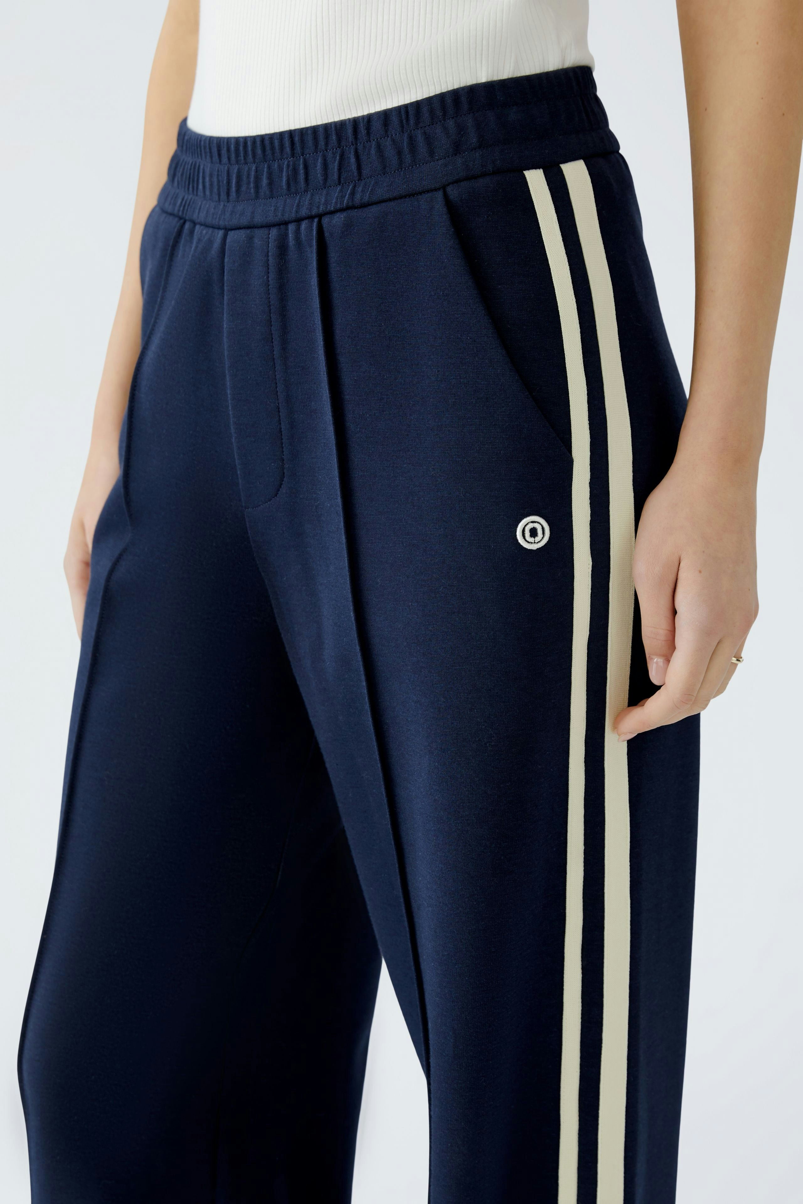 Comfortable women's pants in navy with stylish side stripes and pockets.