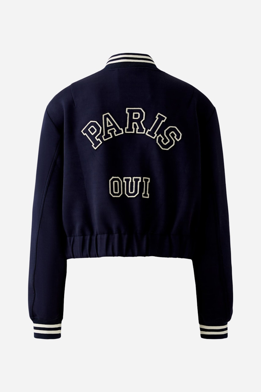 Damen-Blouson: Dunkelblau mit Schriftzug "PARIS OUI" auf der Rückseite, sportlich und modern.