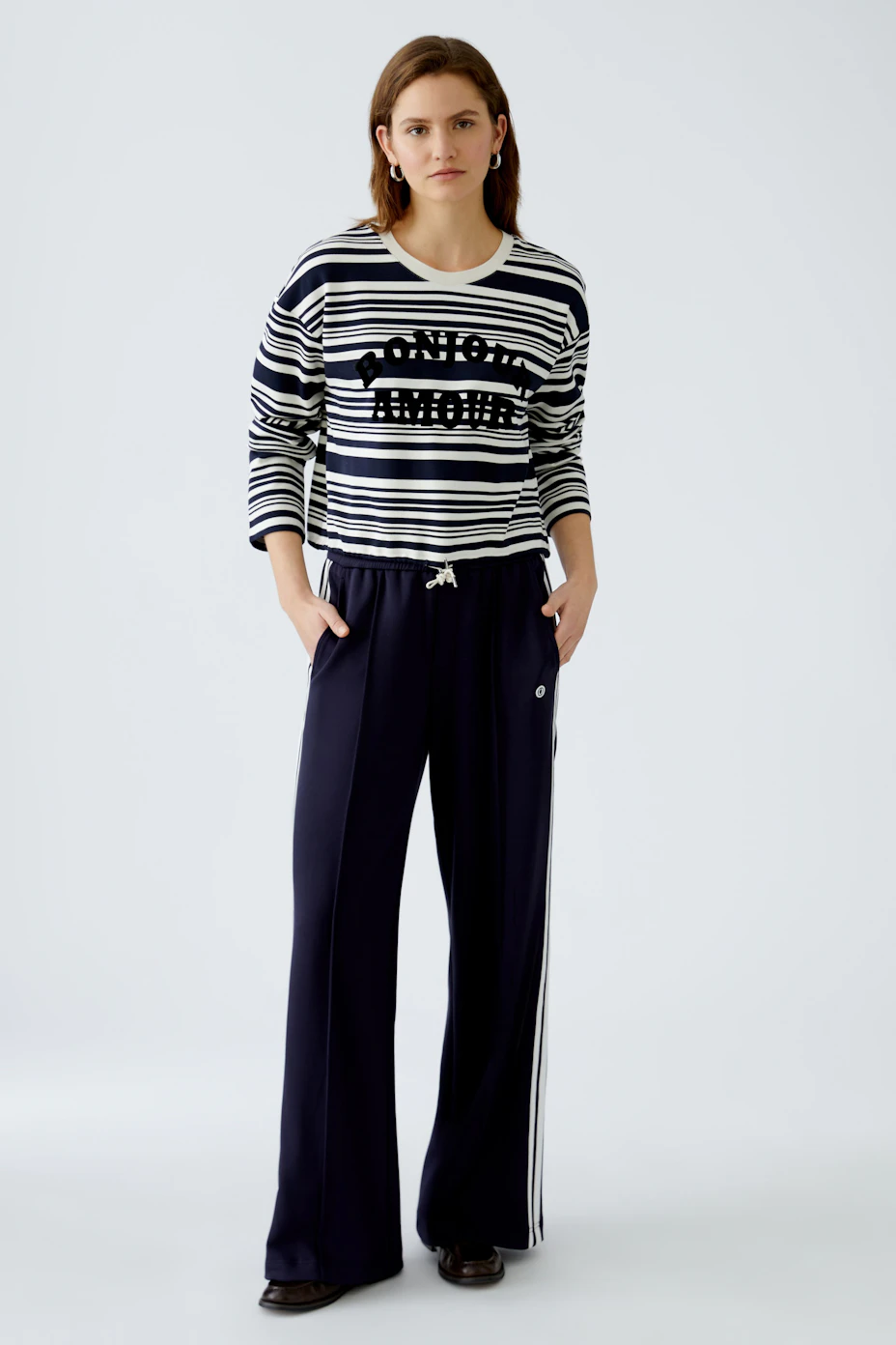 Stylish women's pullover: Navy striped pullover with 'Bonjour Amour' print and drawstring detail.