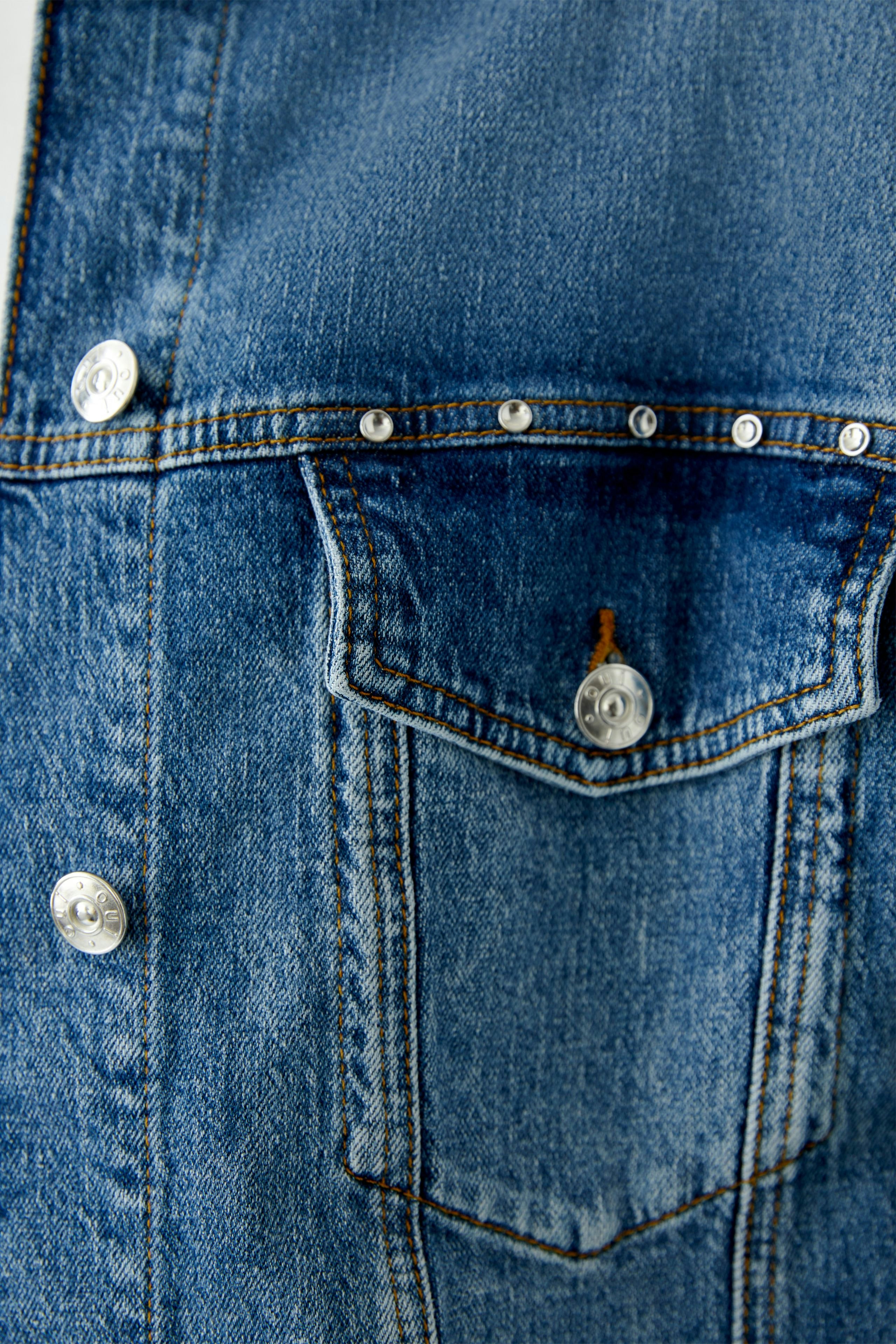 Stylish women's denim jacket with classic button details and a timeless blue wash.