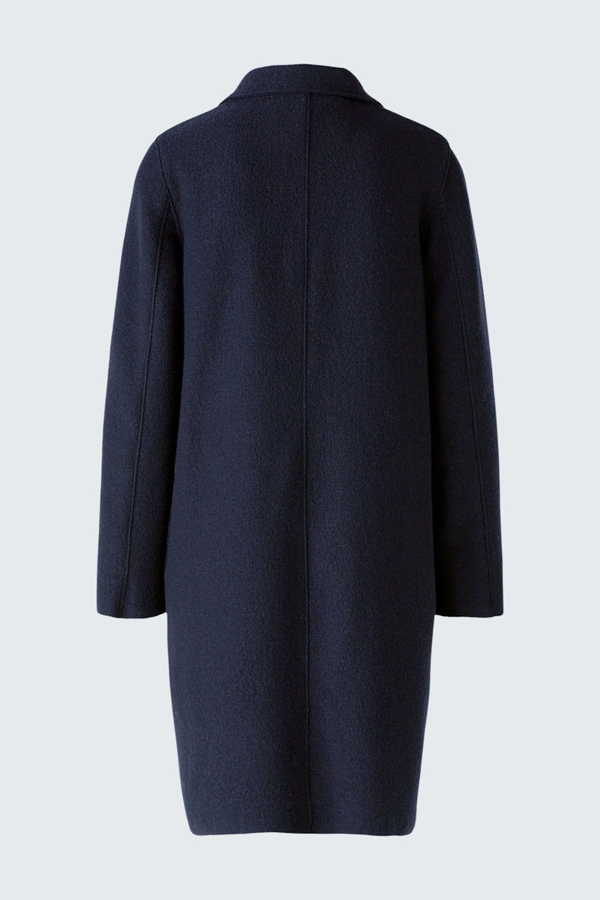 Elegant women's wool coat in dark navy, featuring a minimalist design and a tailored fit.