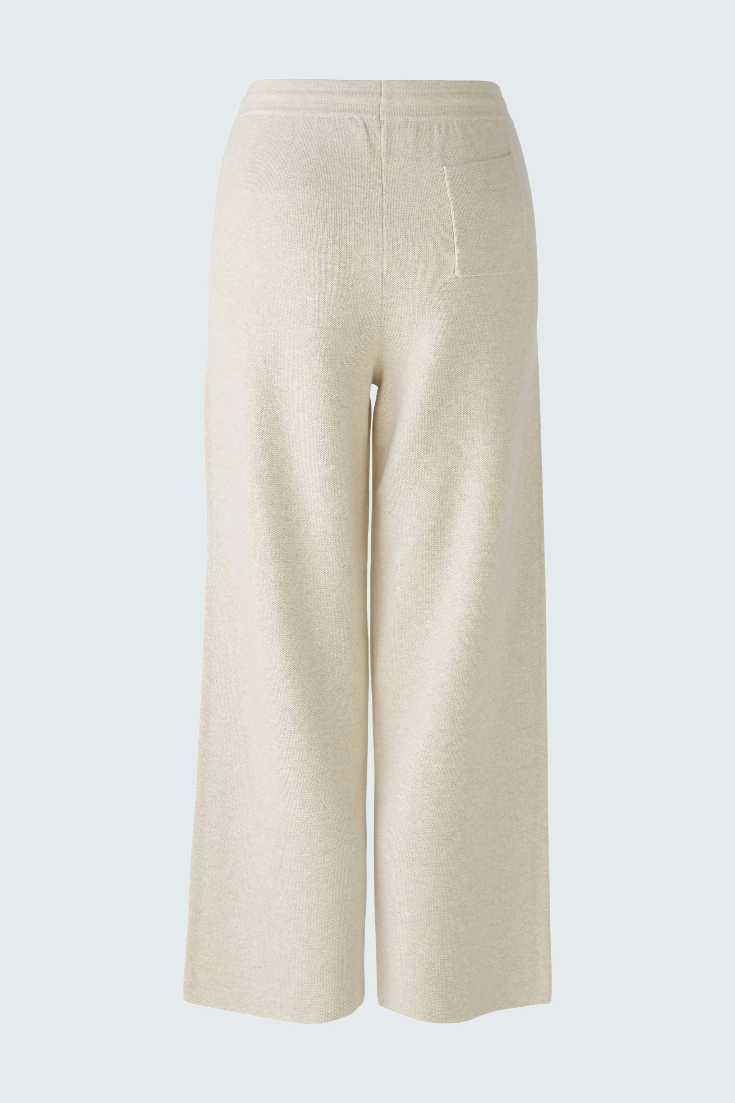 Chic women's knit pants in soft beige, perfect for casual and comfortable styling.