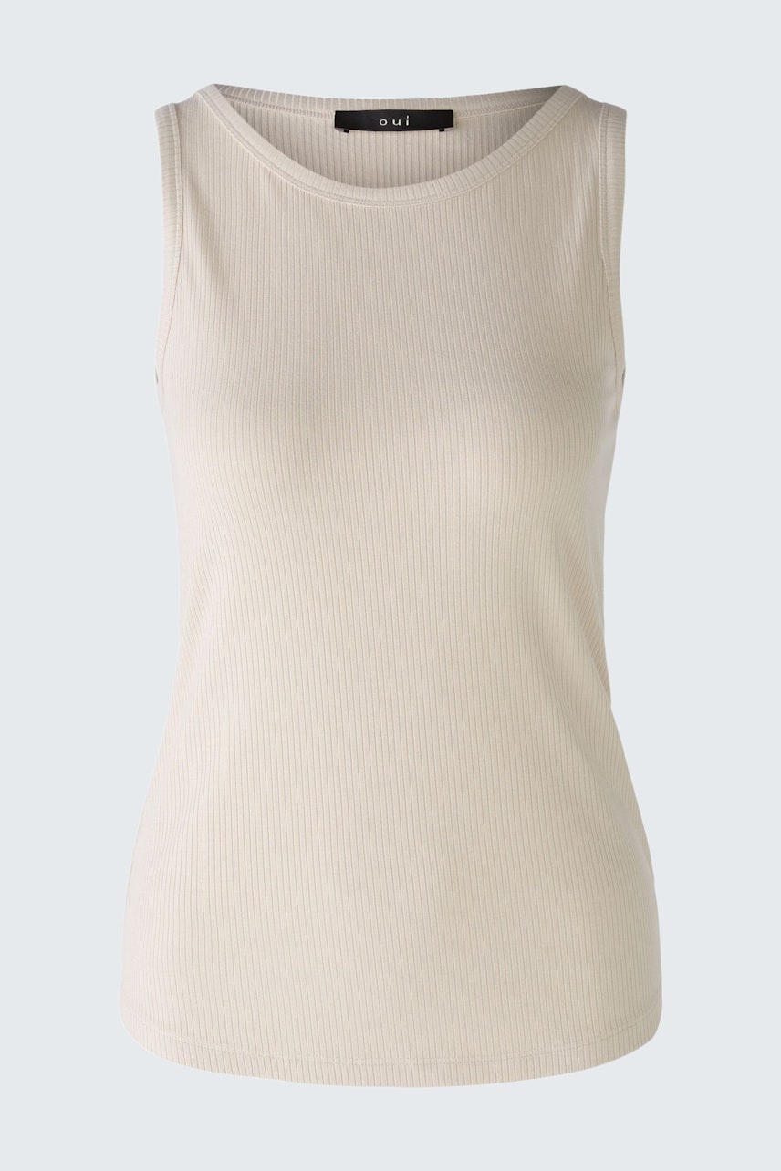 Elegant women's top in soft beige, perfect for layering or wearing alone.