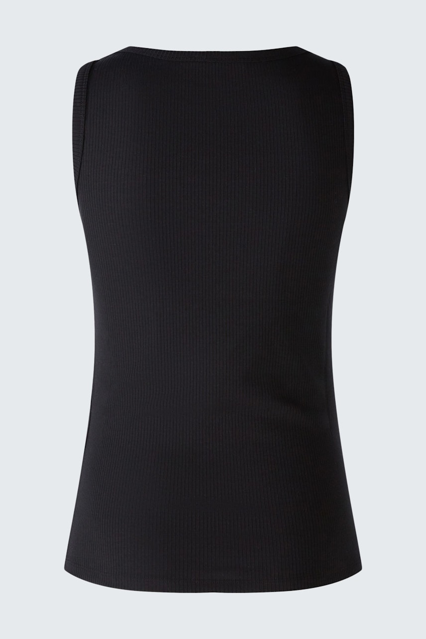 Sleek black top: A woman showcases a fitted, sleeveless design, perfect for layering or solo wear.