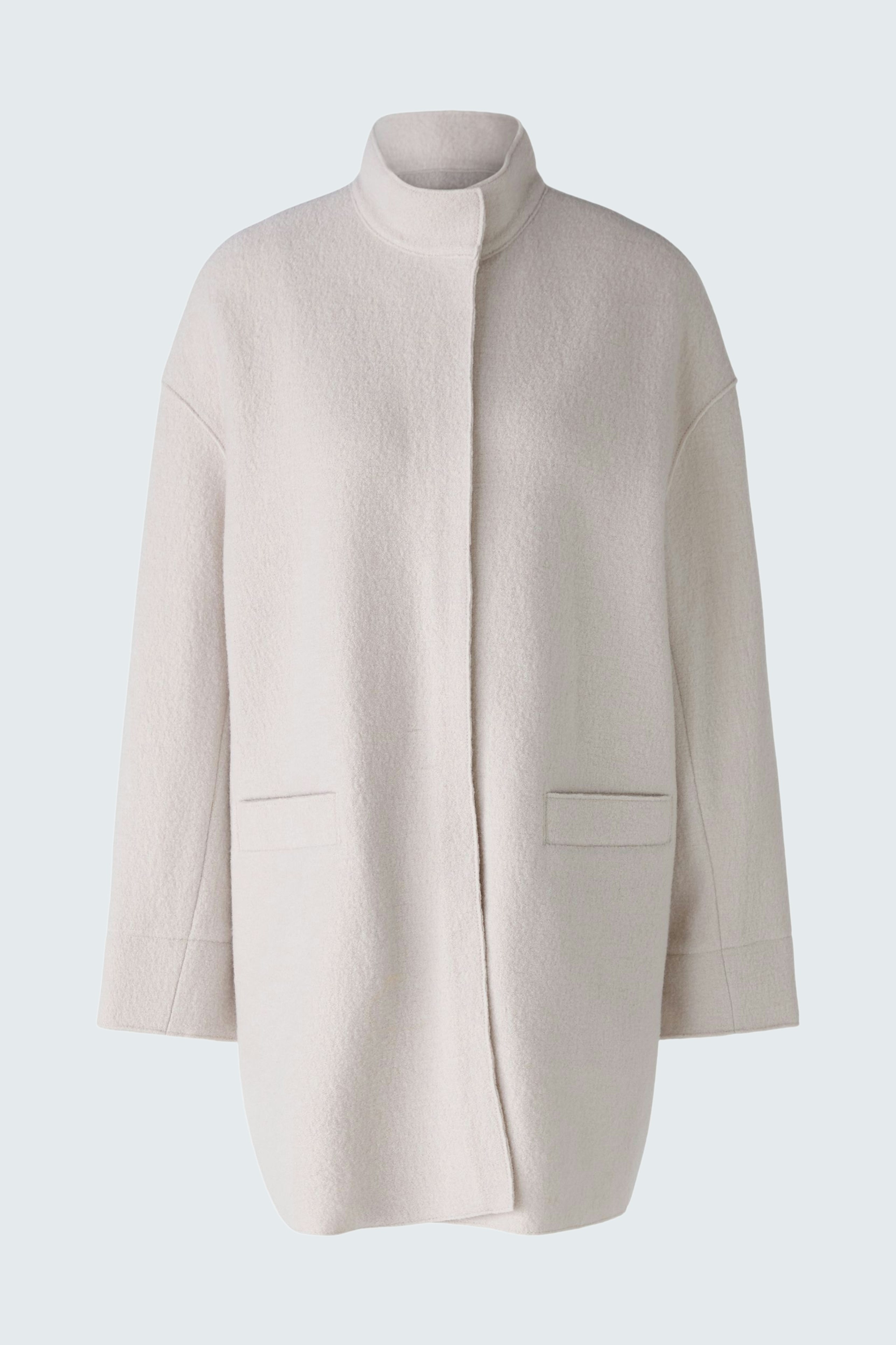 Stylish women's coat in soft cream fabric, featuring a relaxed fit and minimalistic design.