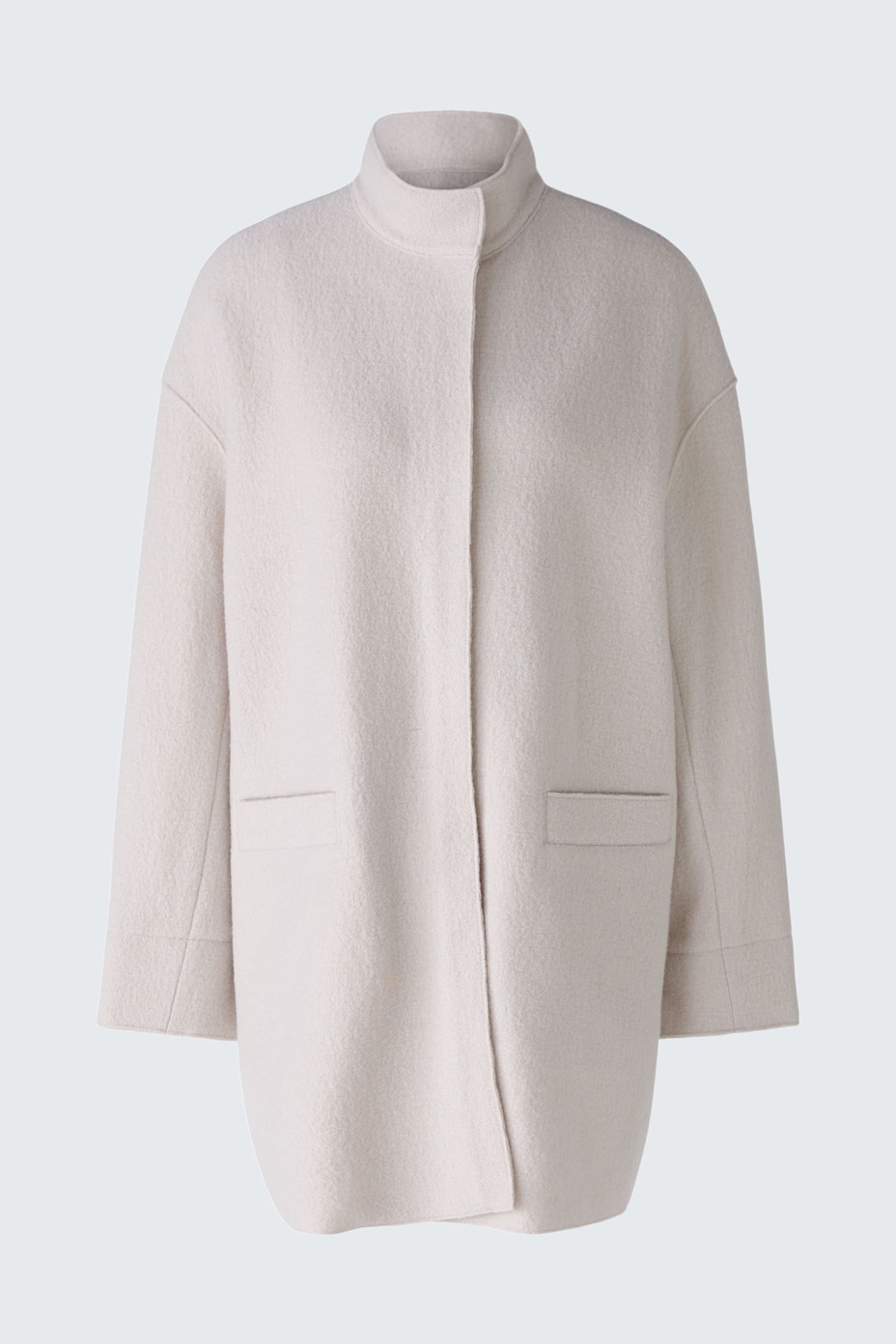 Stylish women's coat in soft cream fabric, featuring a relaxed fit and minimalistic design.