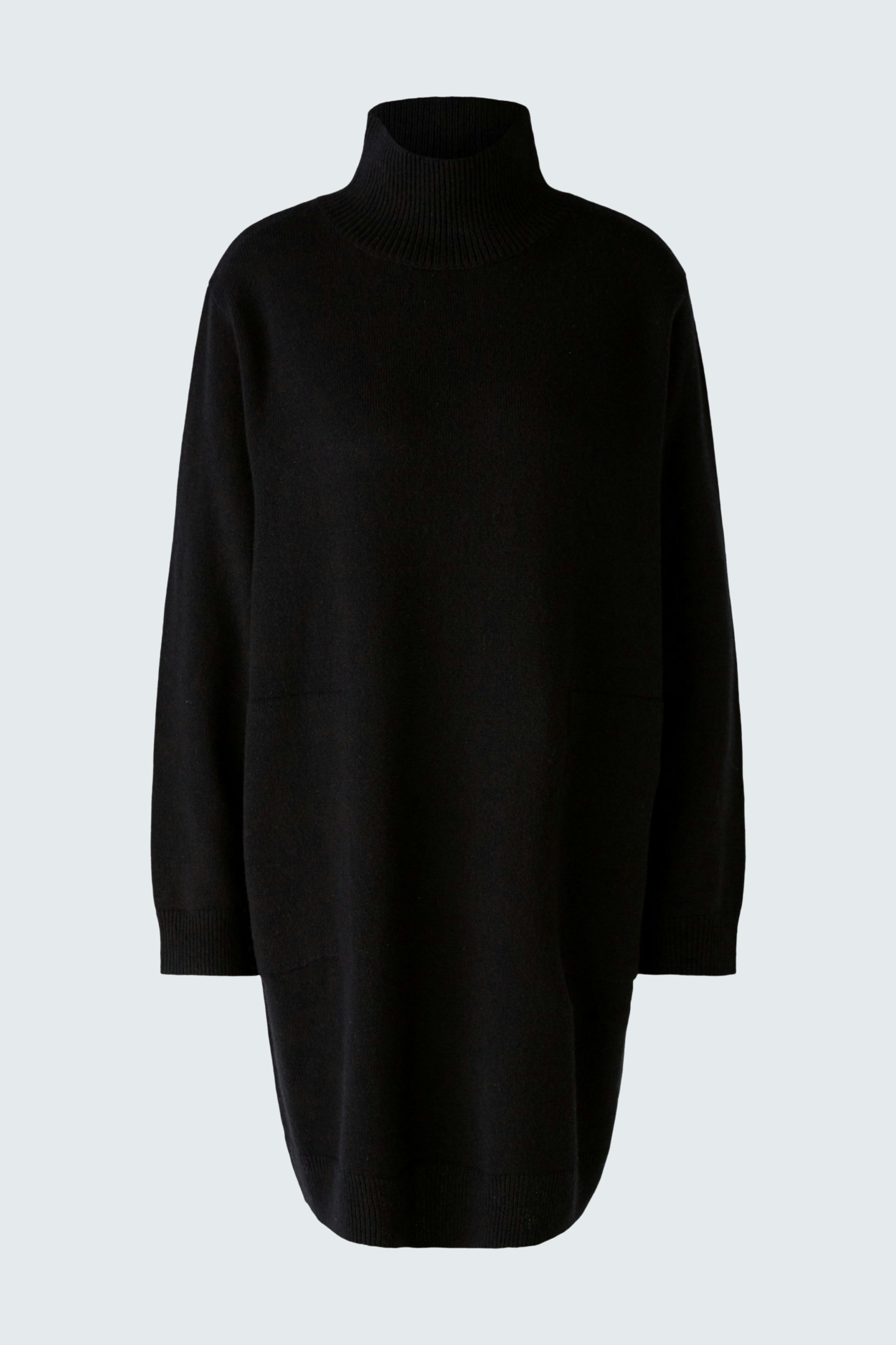 Chic women's pullover: A woman in a black turtleneck pullover, showcasing a modern and elegant style.