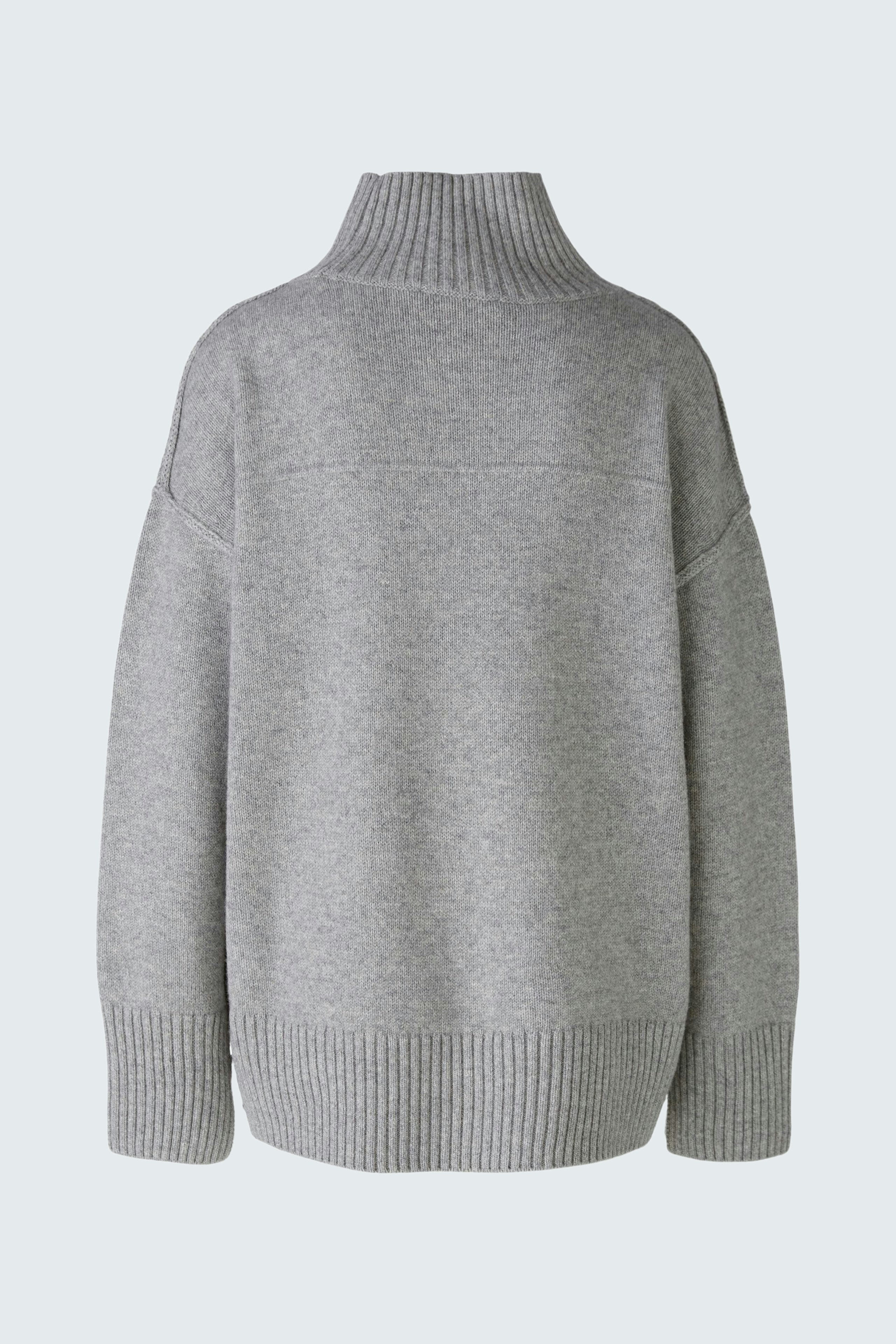 Cozy women's pullover in soft gray with a high collar and relaxed fit, perfect for layering.