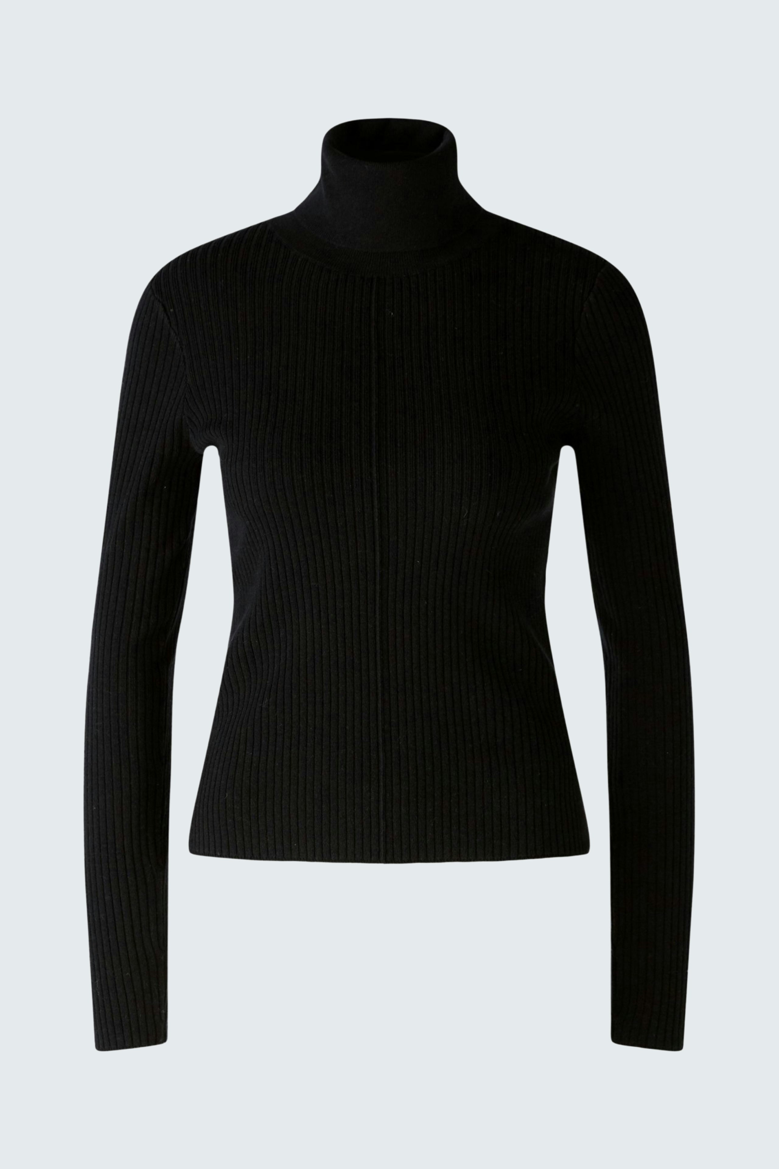 Elegant women's pullover: A woman in a fitted black ribbed turtleneck, showcasing a sleek style.