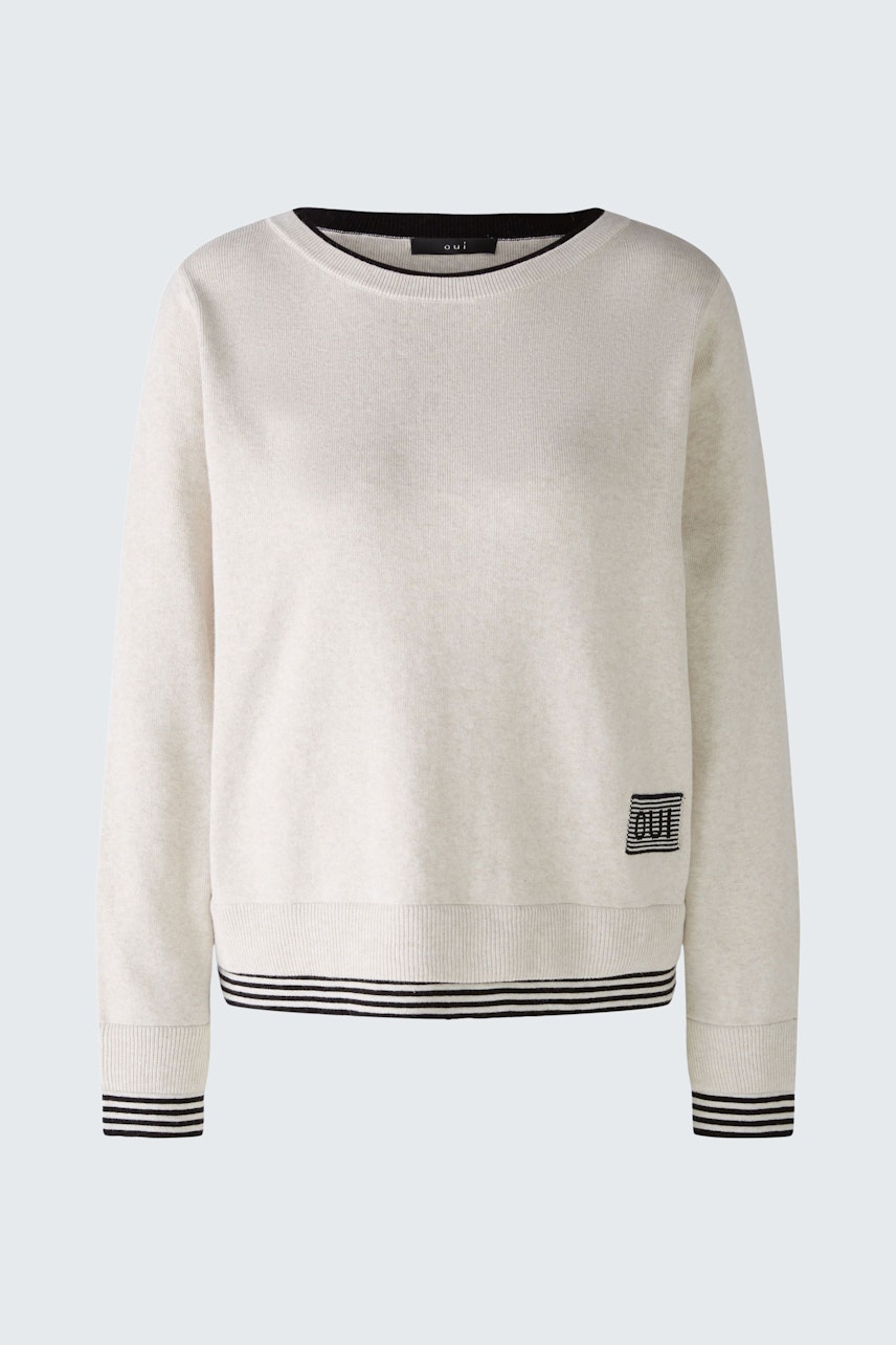 Casual women's pullover in light beige with striped hem and logo detail.