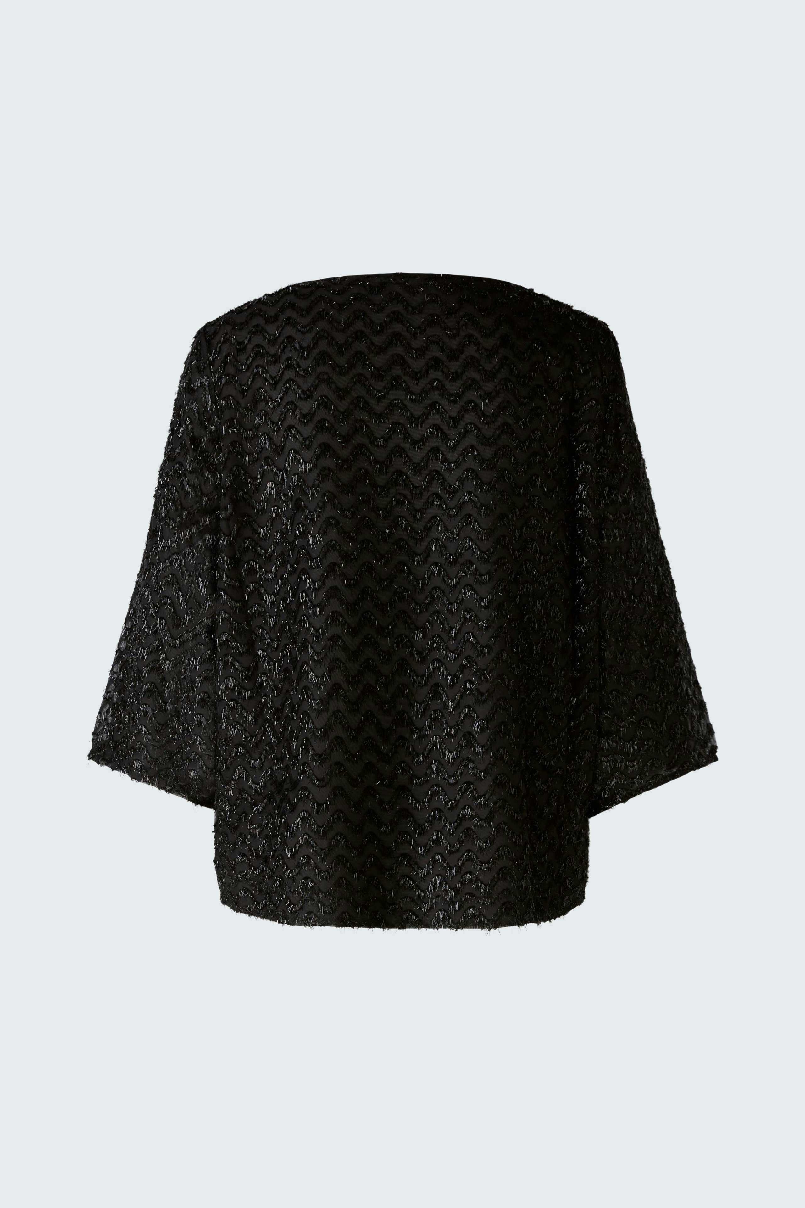 Elegant women's pullover: A woman in a stylish black pullover with a unique texture, showcasing modern design.