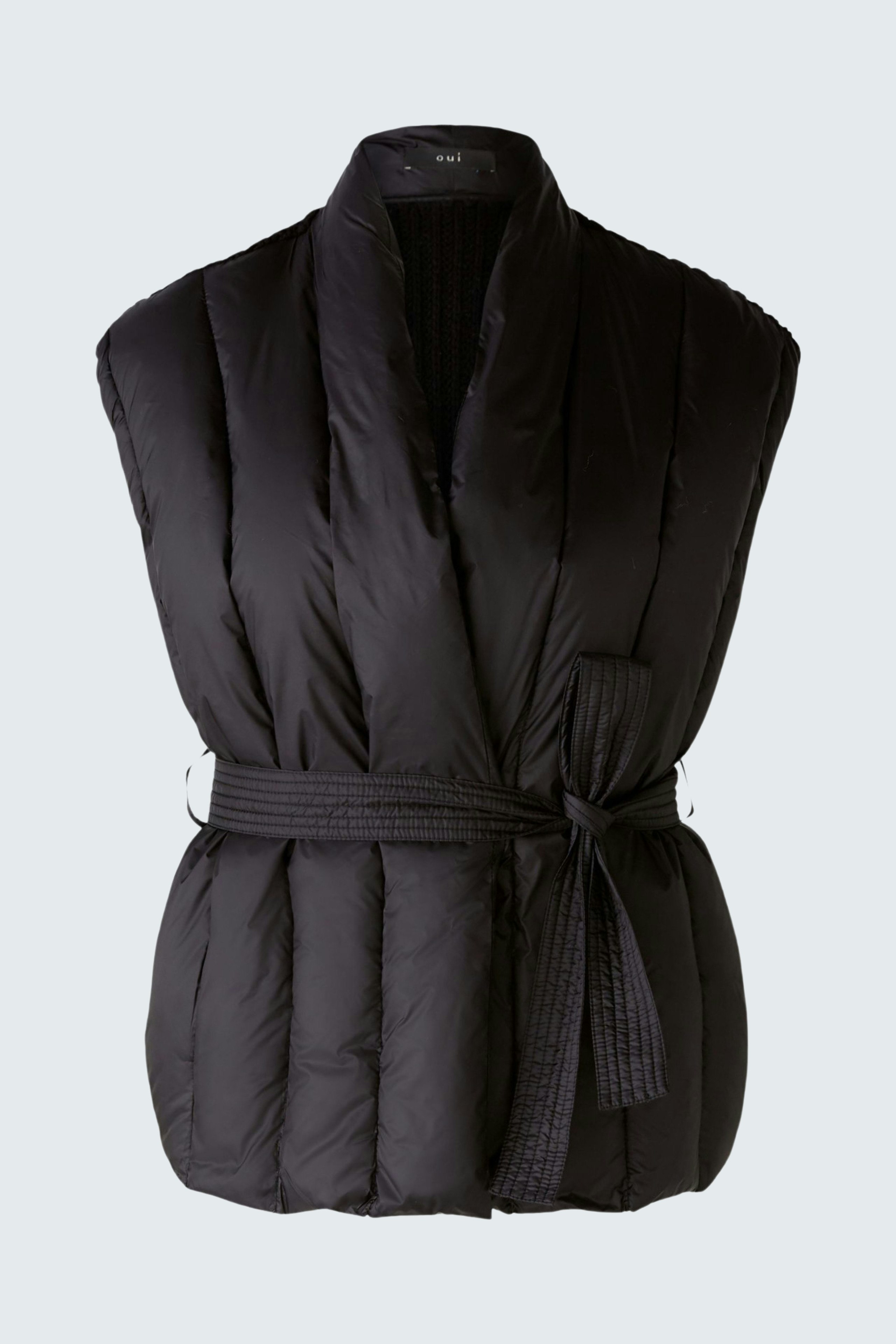 Stylish women's vest: Black padded vest with a belt, perfect for layering in colder weather.