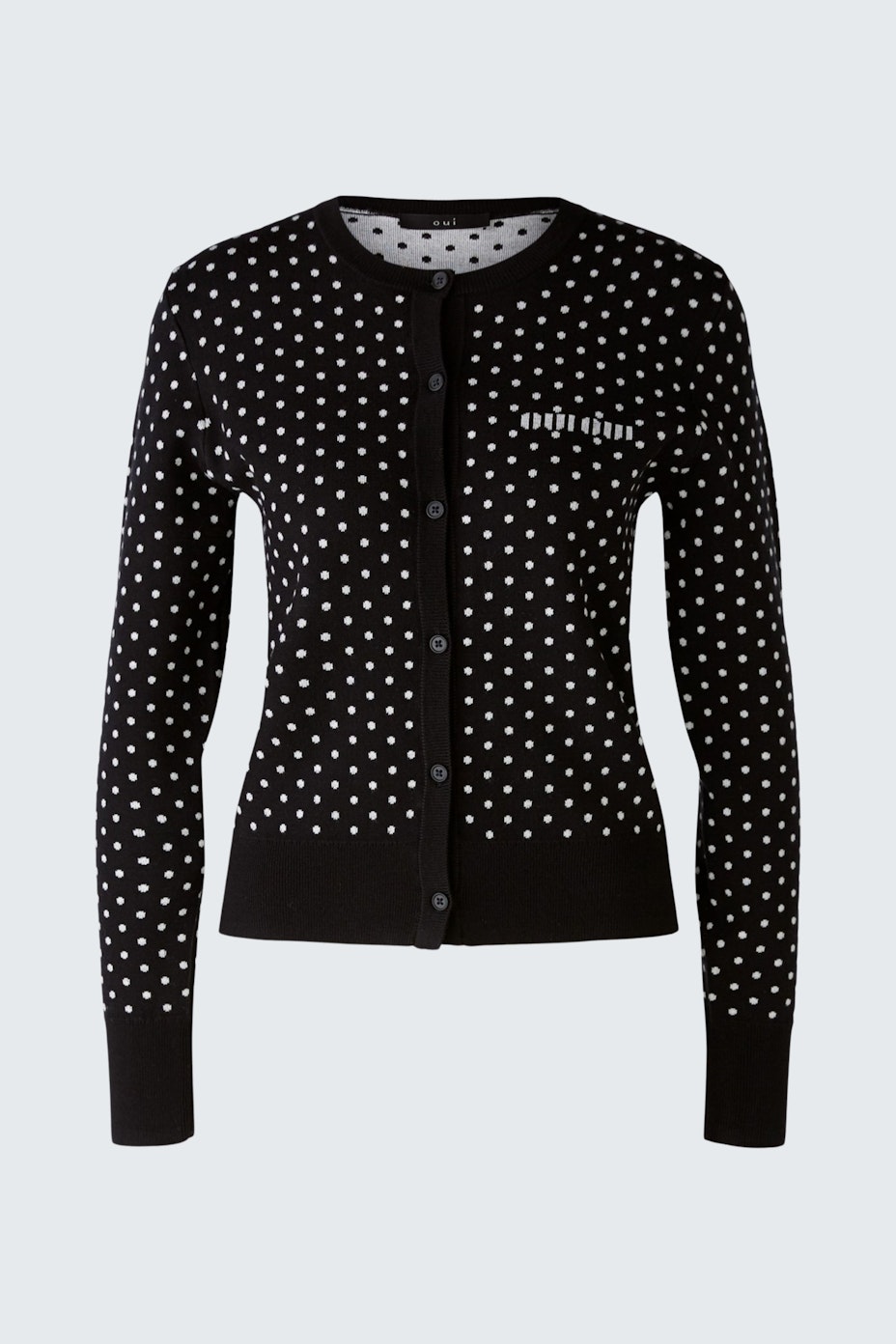 Chic women's pullover: Black cardigan with white polka dots, perfect for stylish layering.