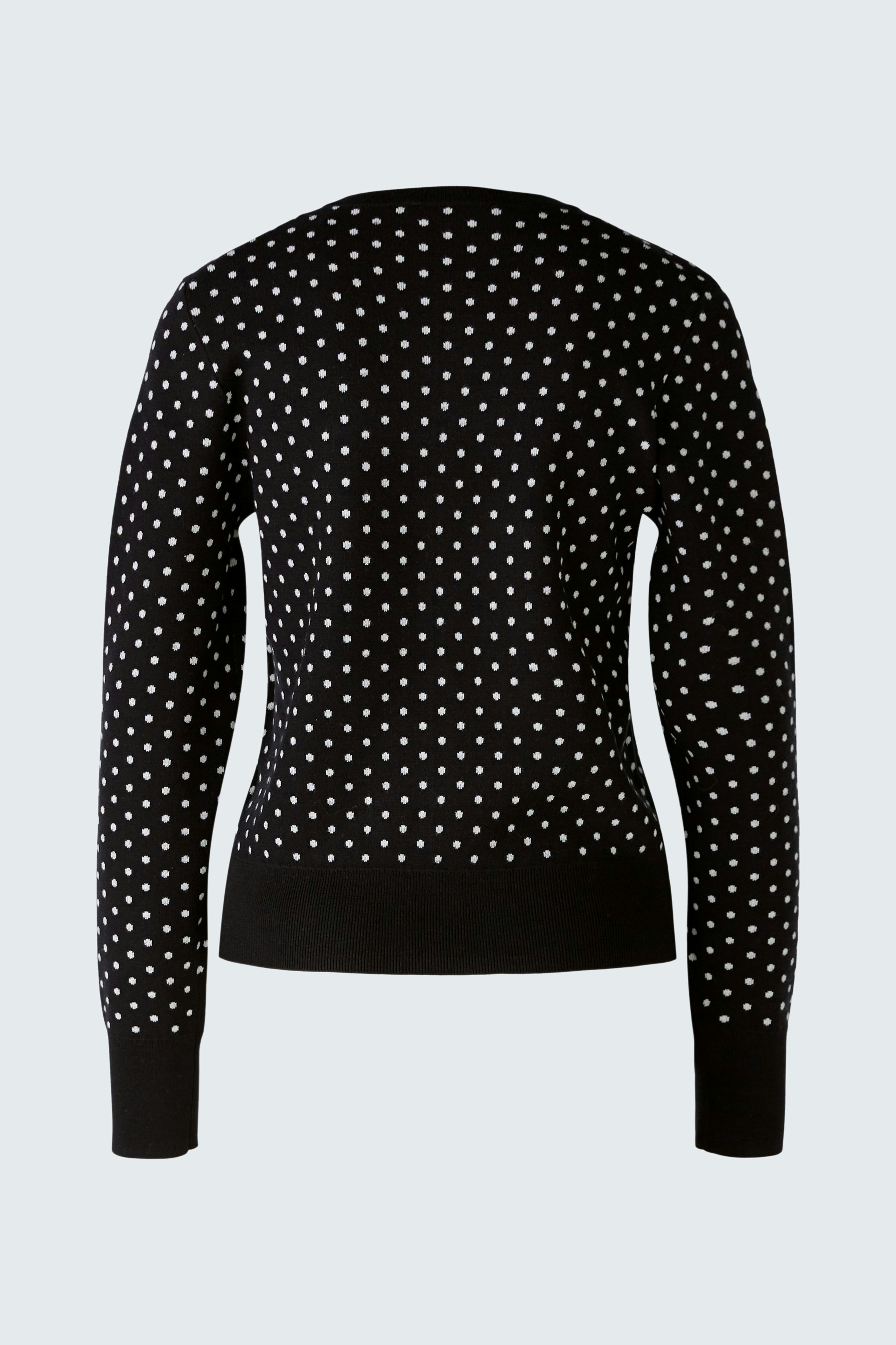 Stylish women's pullover: Black pullover with white polka dots, perfect for casual wear.