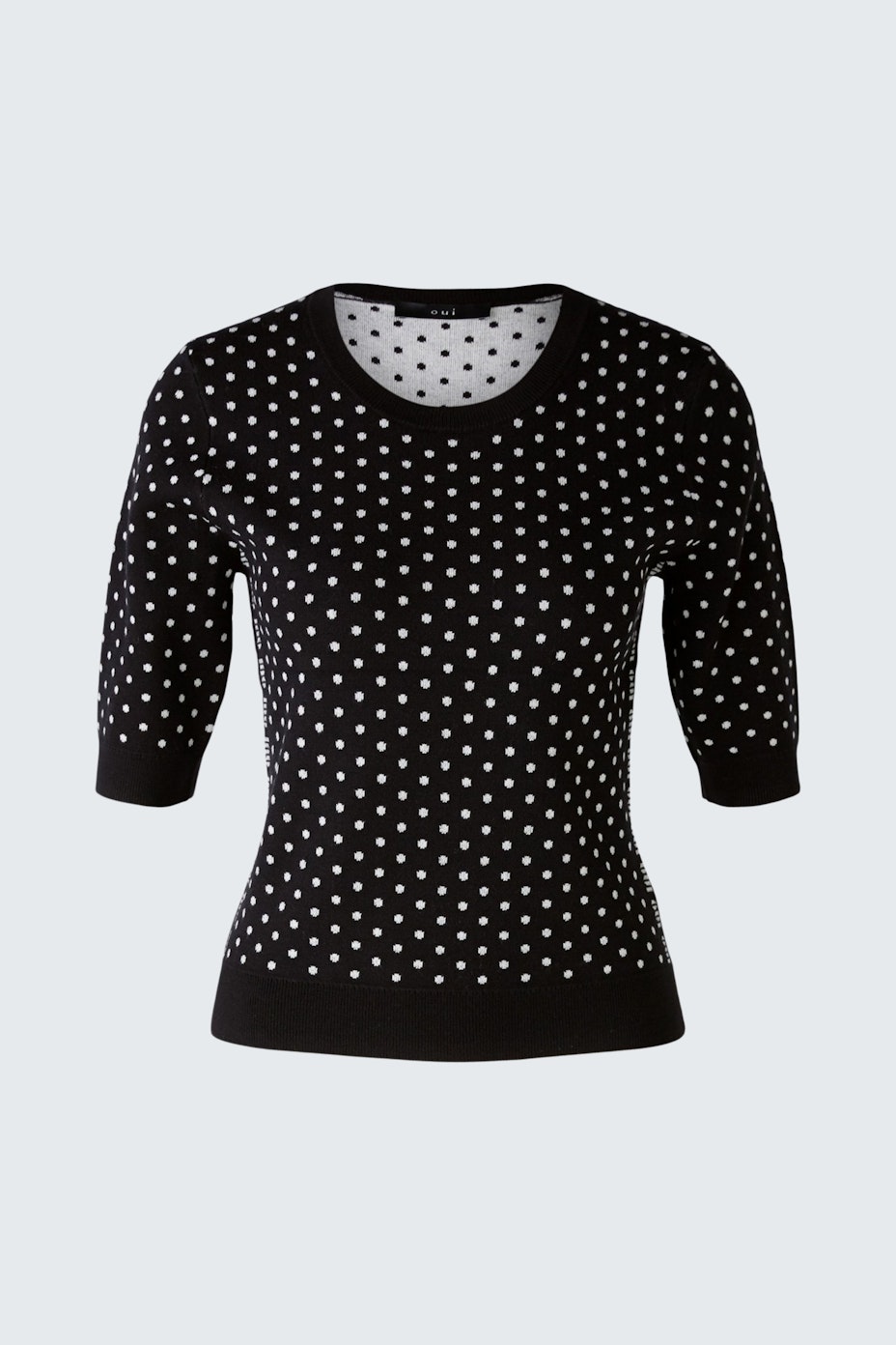 Schwarzer Damen-Pullover mit weißen Punkten, lässig und modern, ideal für jeden Anlass.