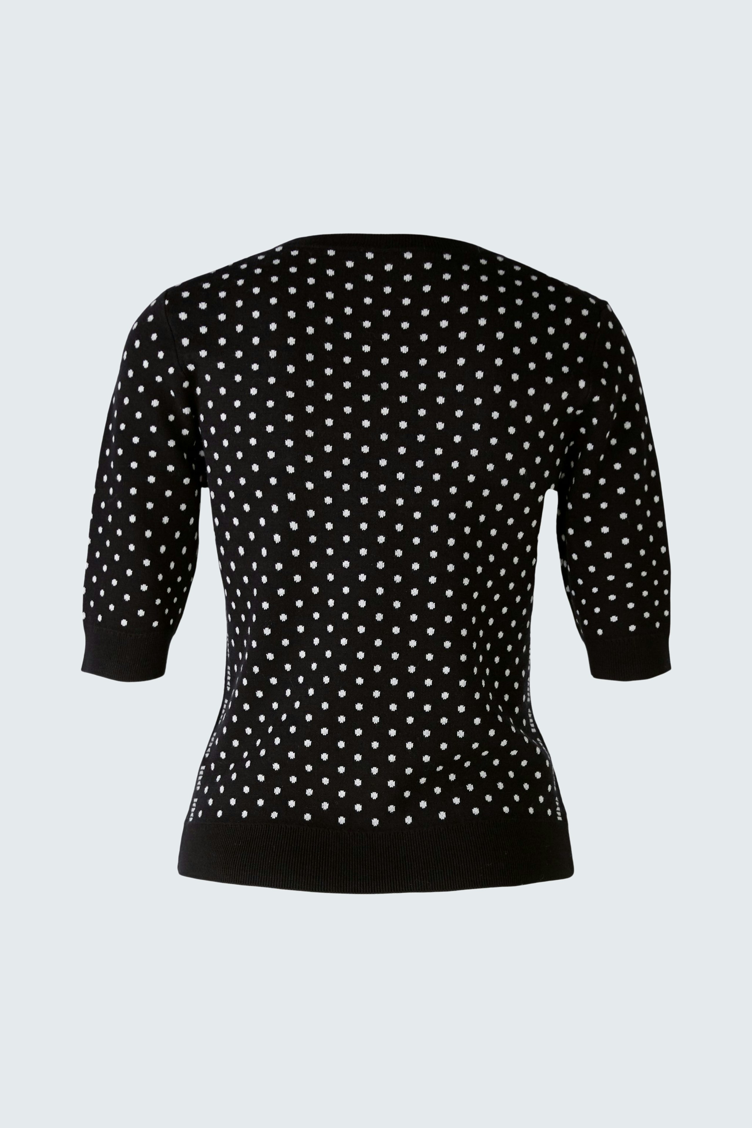 Stylish women's pullover: Black with white polka dots, perfect for casual or chic outfits.