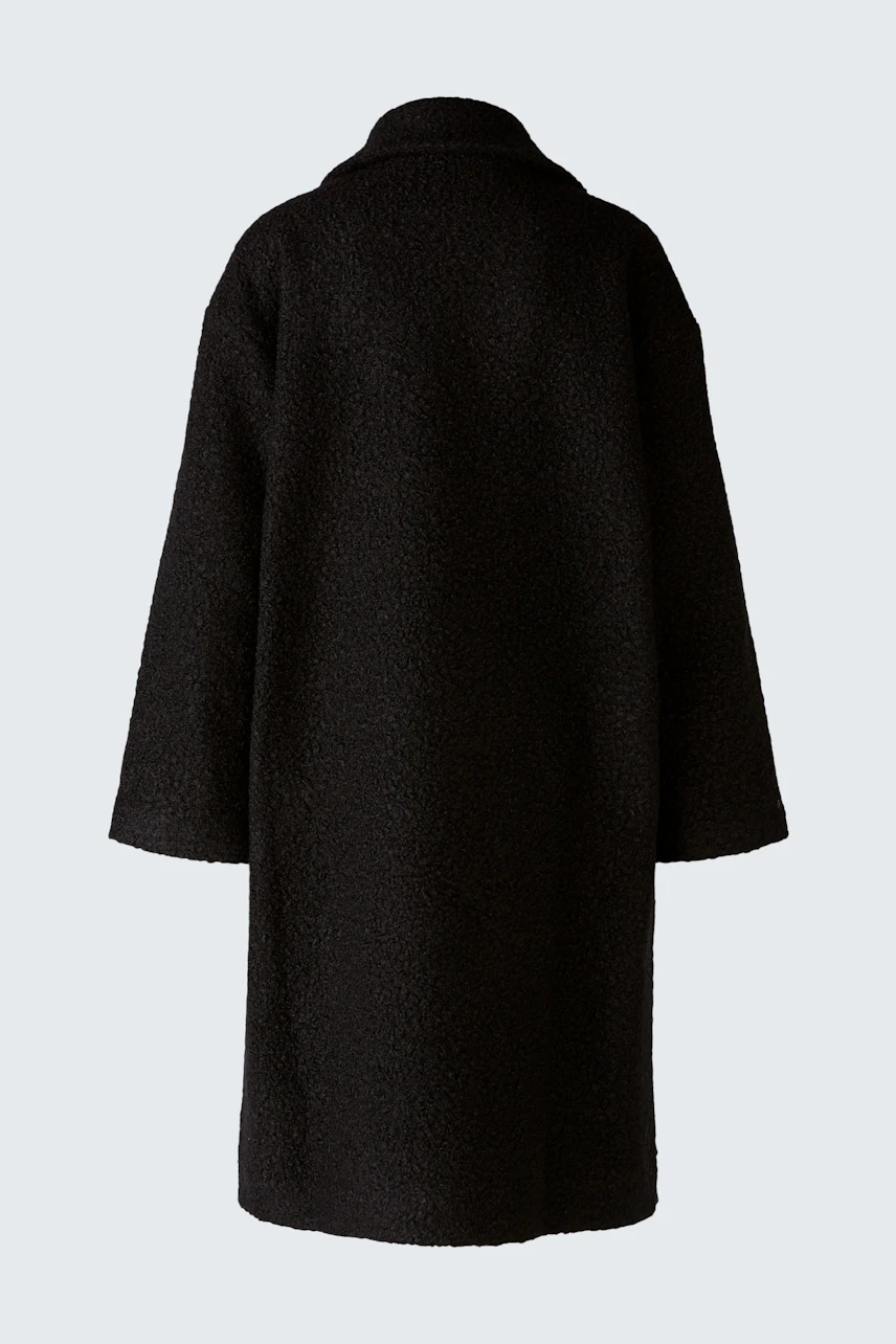 Elegant women's winter coat in black, featuring a classic silhouette and cozy fabric.
