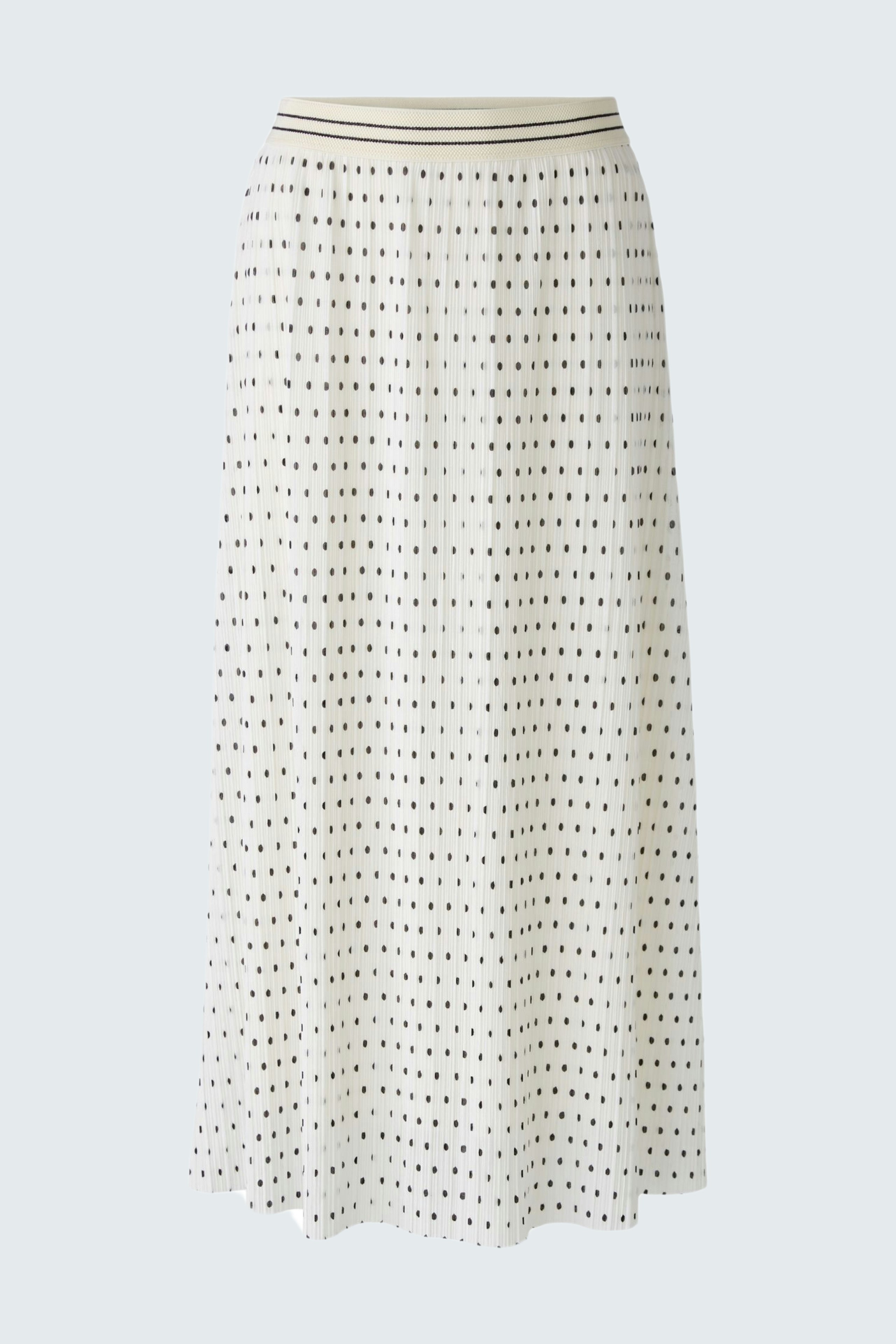Elegant pleated skirt: A stylish white skirt with a flowing design, perfect for any occasion.