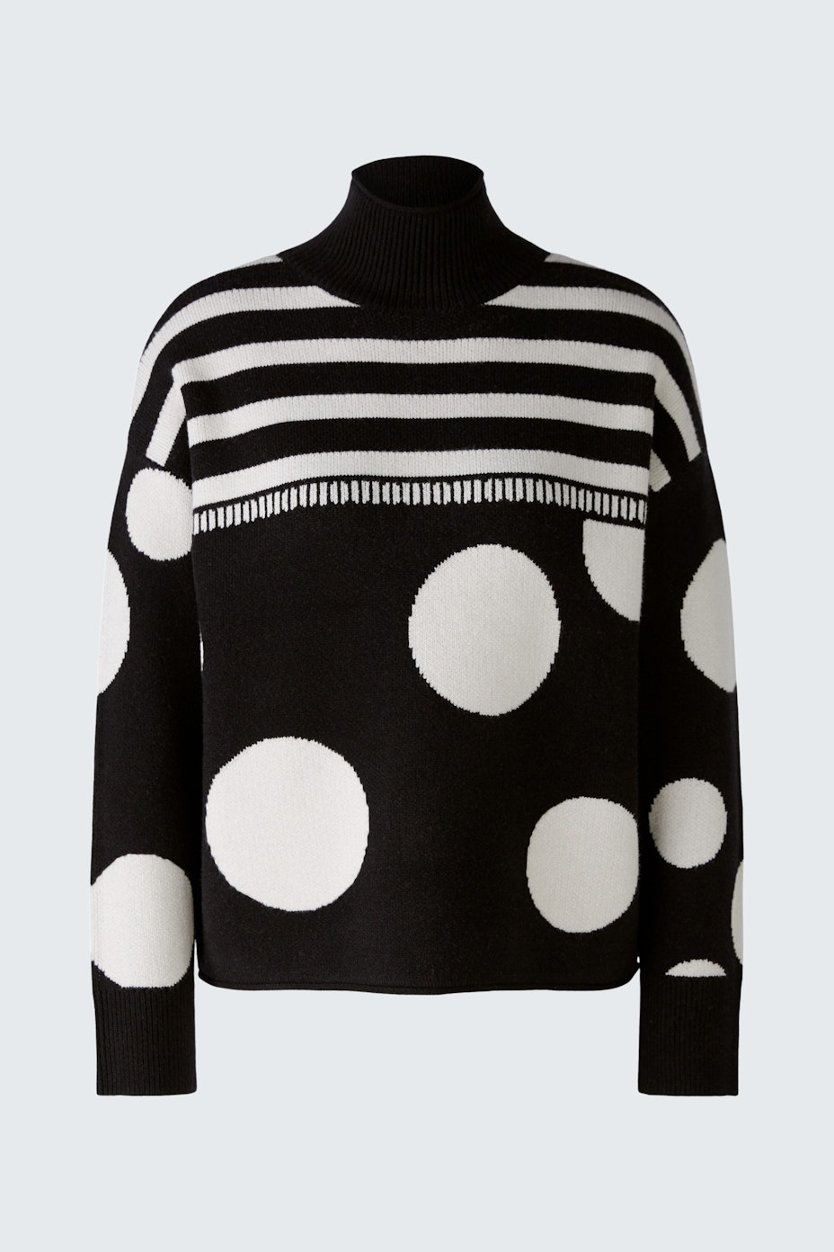 Stylish women's pullover: Black and white striped design with polka dots, perfect for a modern look.