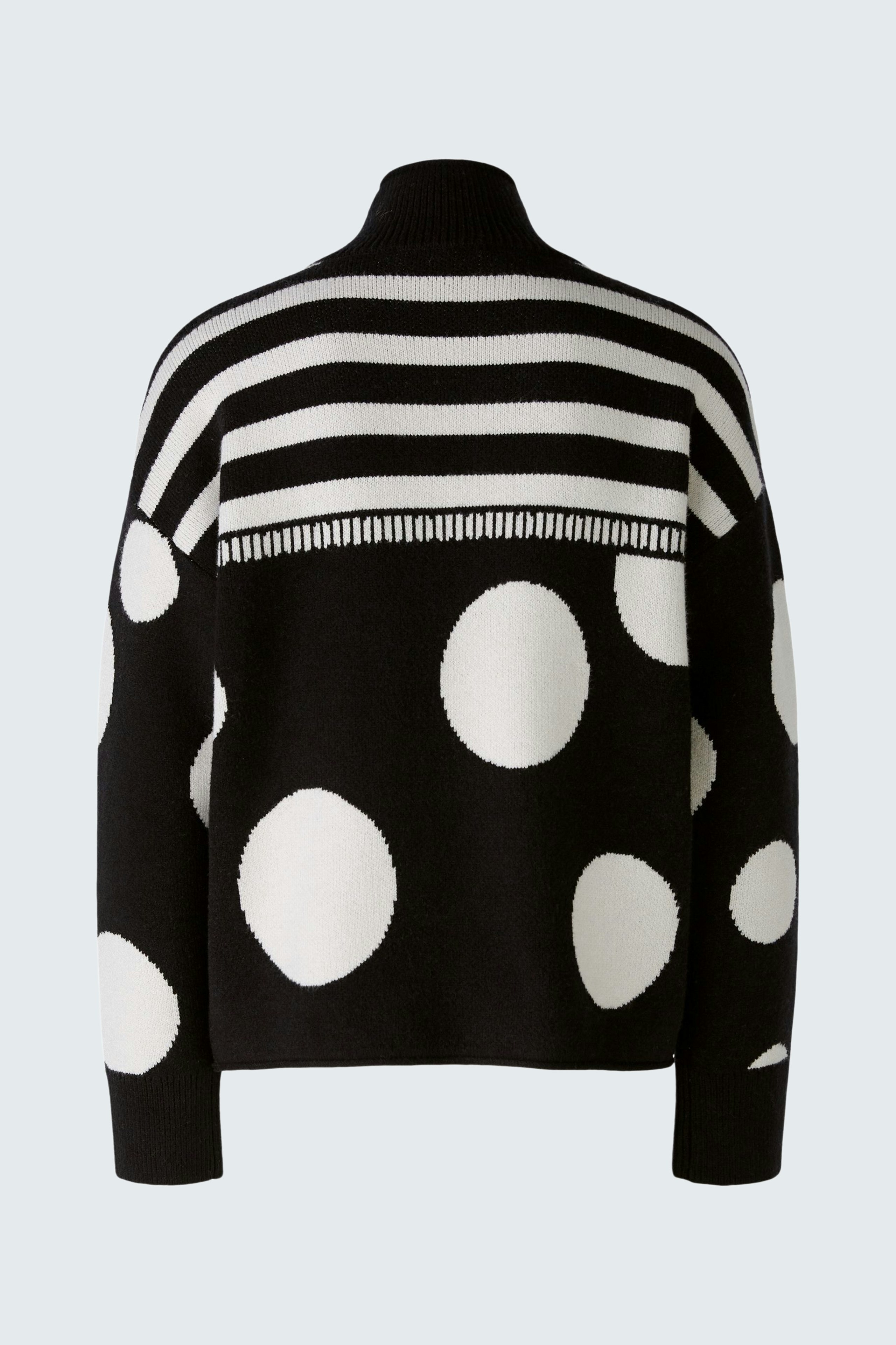 Stylish women's pullover: Black and white striped pullover with polka dots, perfect for a modern look.
