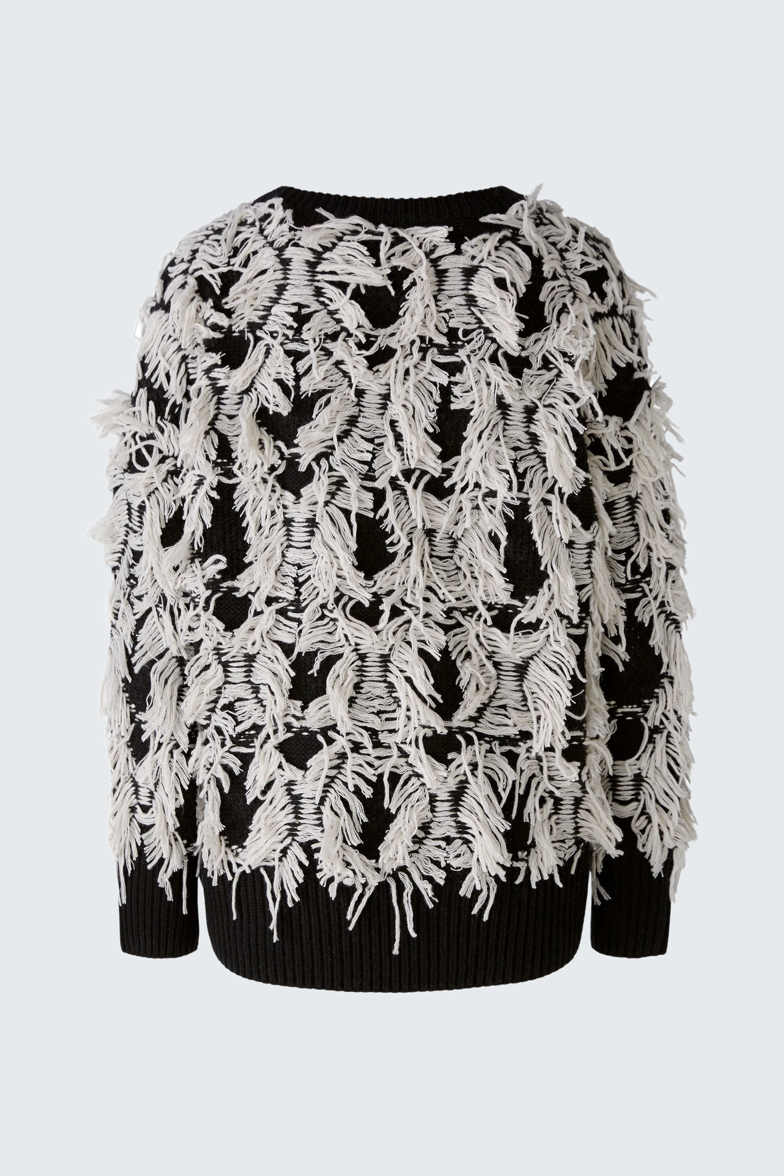 Stylish women's pullover with a unique fringe design in black and white, perfect for a trendy look.