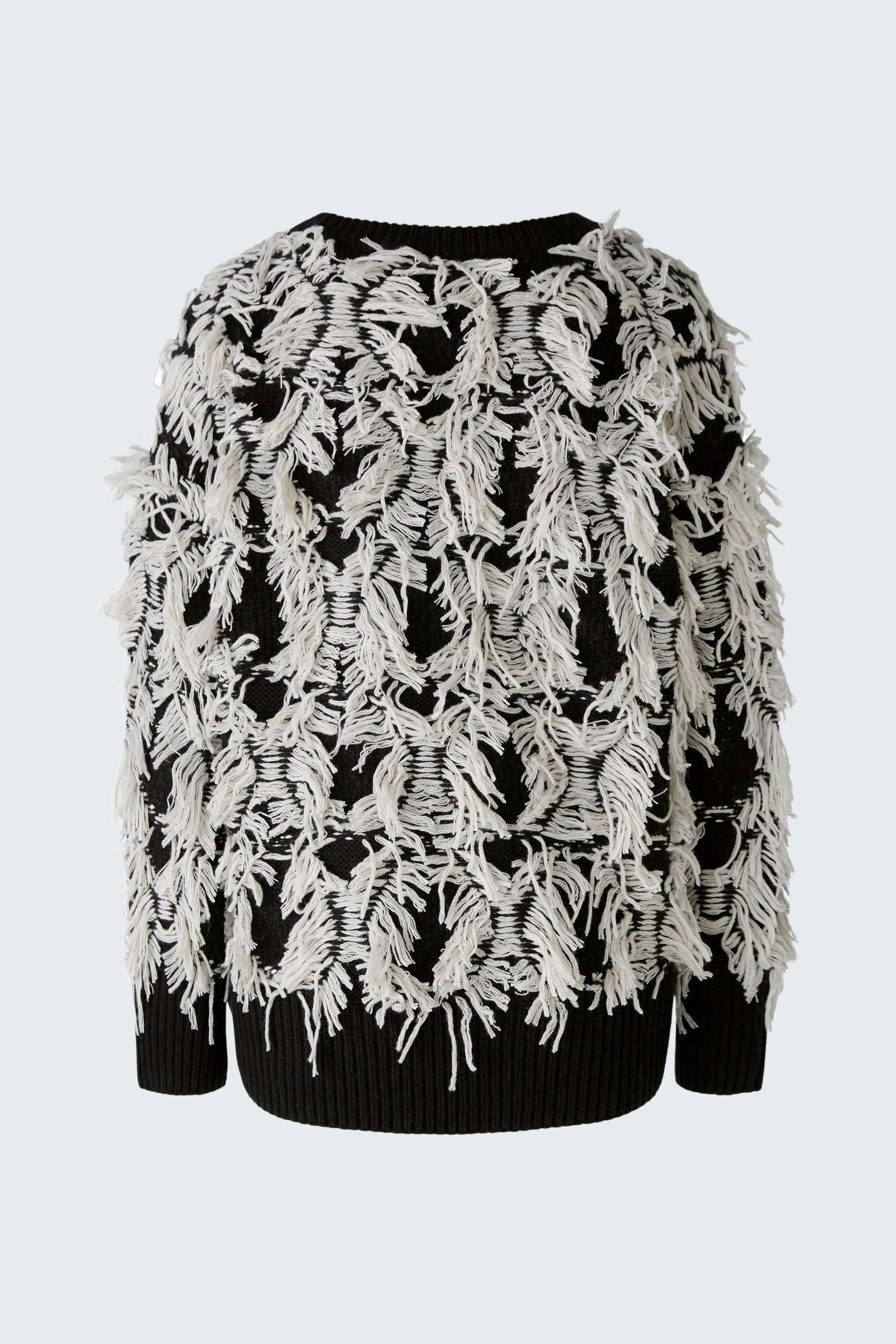 Stylish women's pullover with a unique fringe design in black and white, perfect for a trendy look.