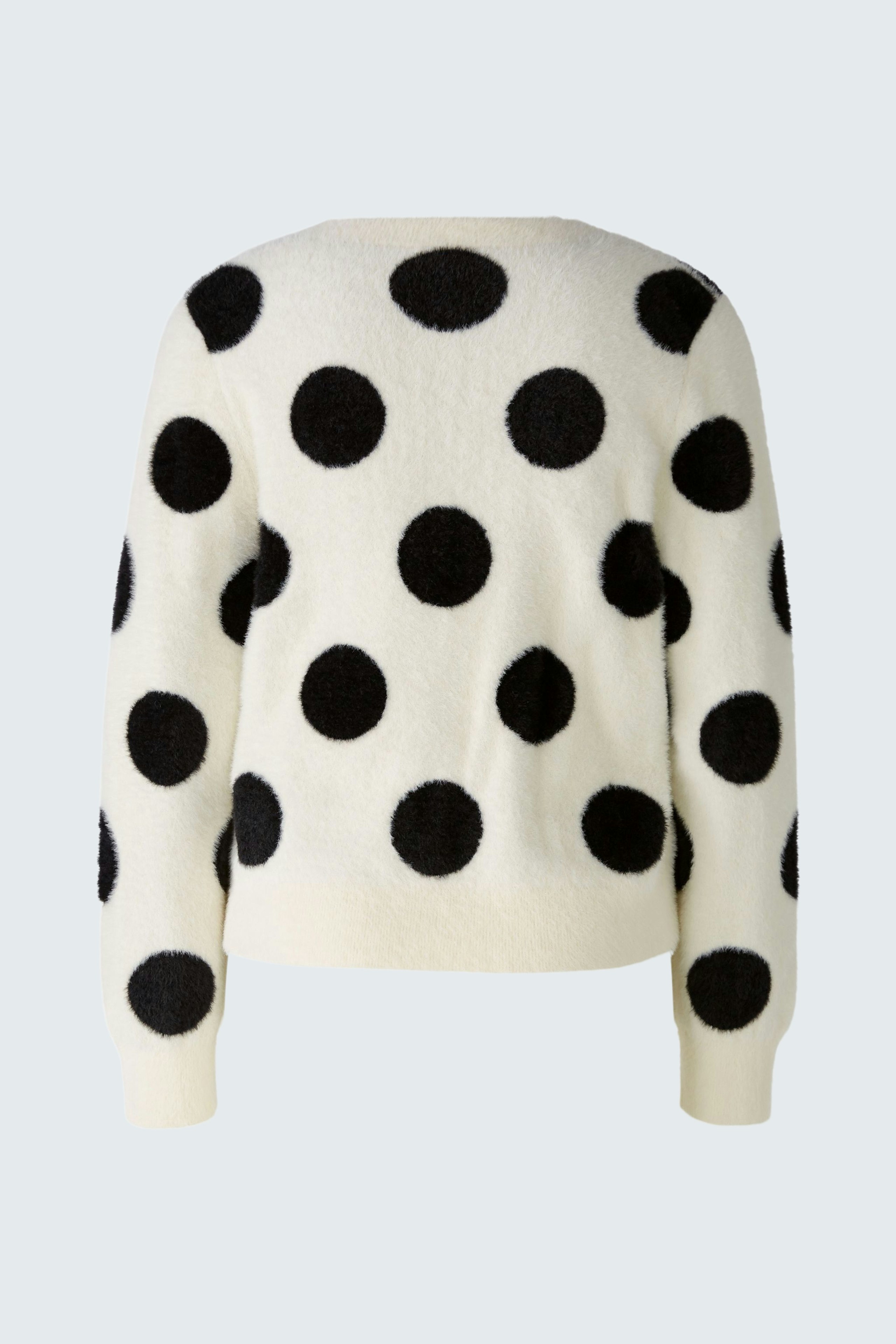 Bequemer Damen-Pullover in Creme mit schwarzen Punkten, ideal für lässige Outfits.