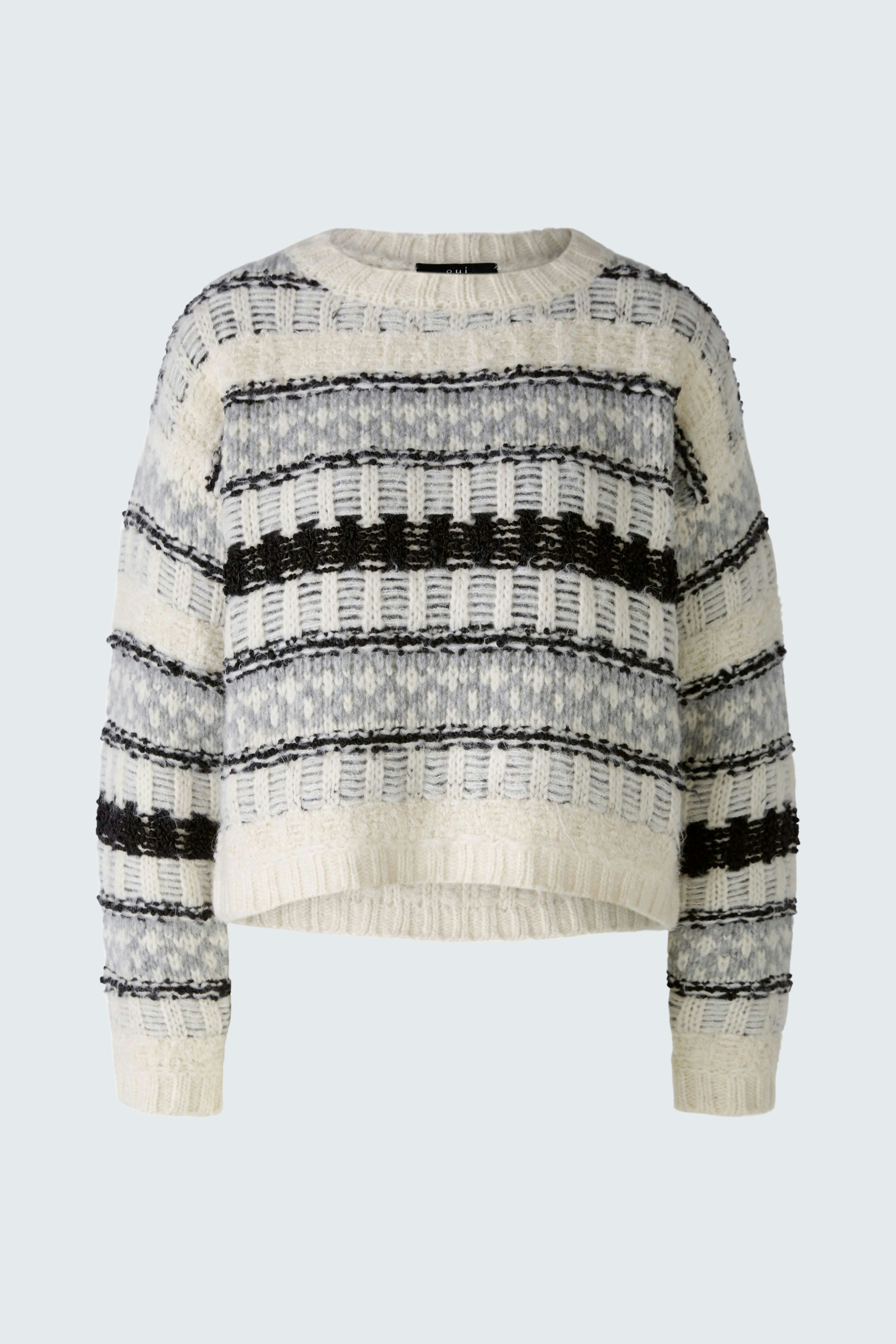 Gemusterter Damen-Pullover in Creme und Schwarz mit lässigem Schnitt und Rundhalsausschnitt.