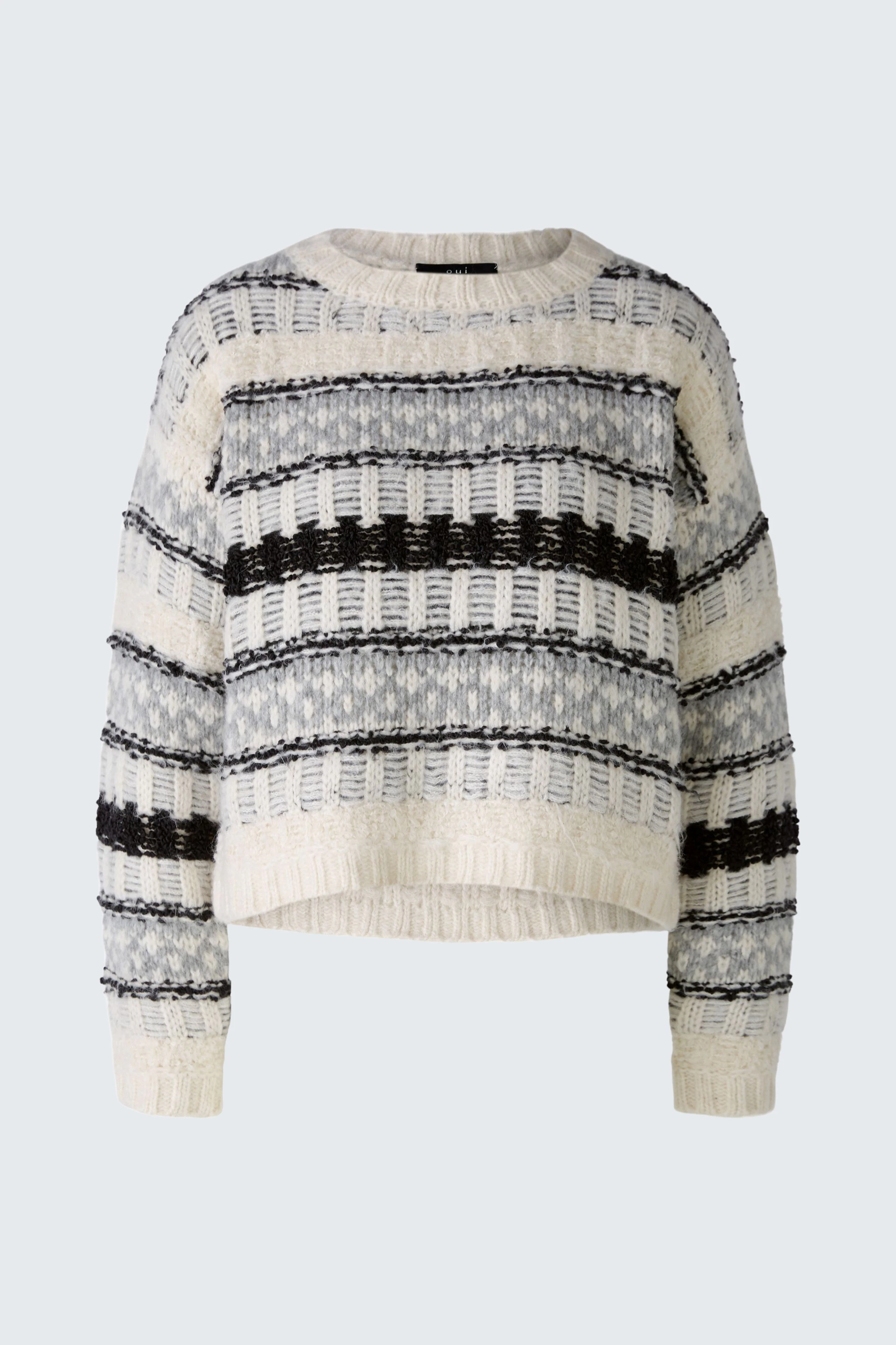 Gemusterter Damen-Pullover in Creme und Schwarz mit lässigem Schnitt und Rundhalsausschnitt.