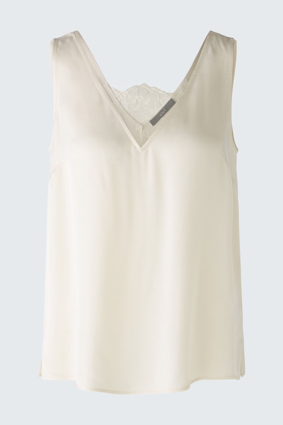 Elegant women's top: A light cream sleeveless design with a delicate lace detail at the neckline.