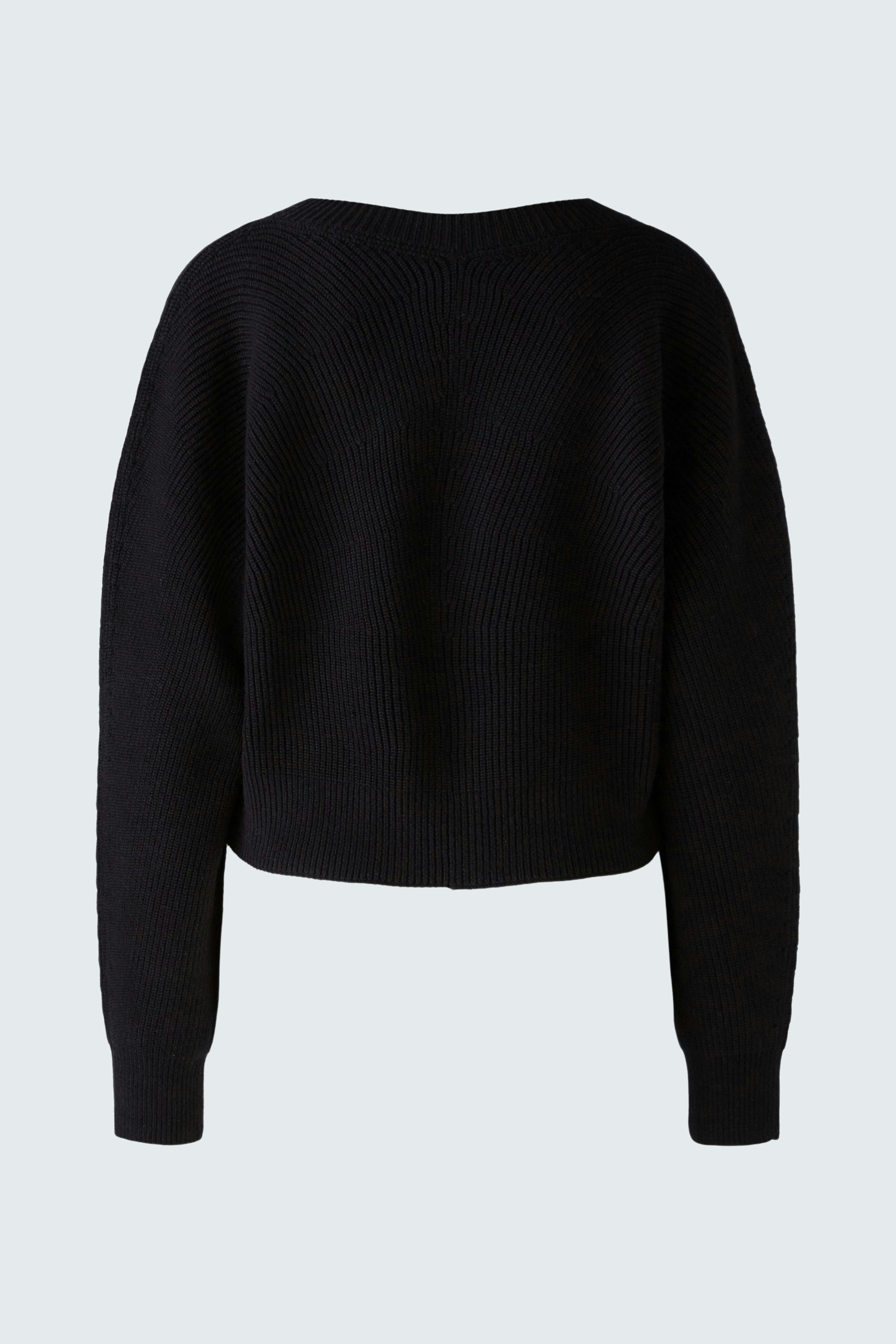 Stylish women's jacket: Black cropped design with ribbed texture, perfect for layering.