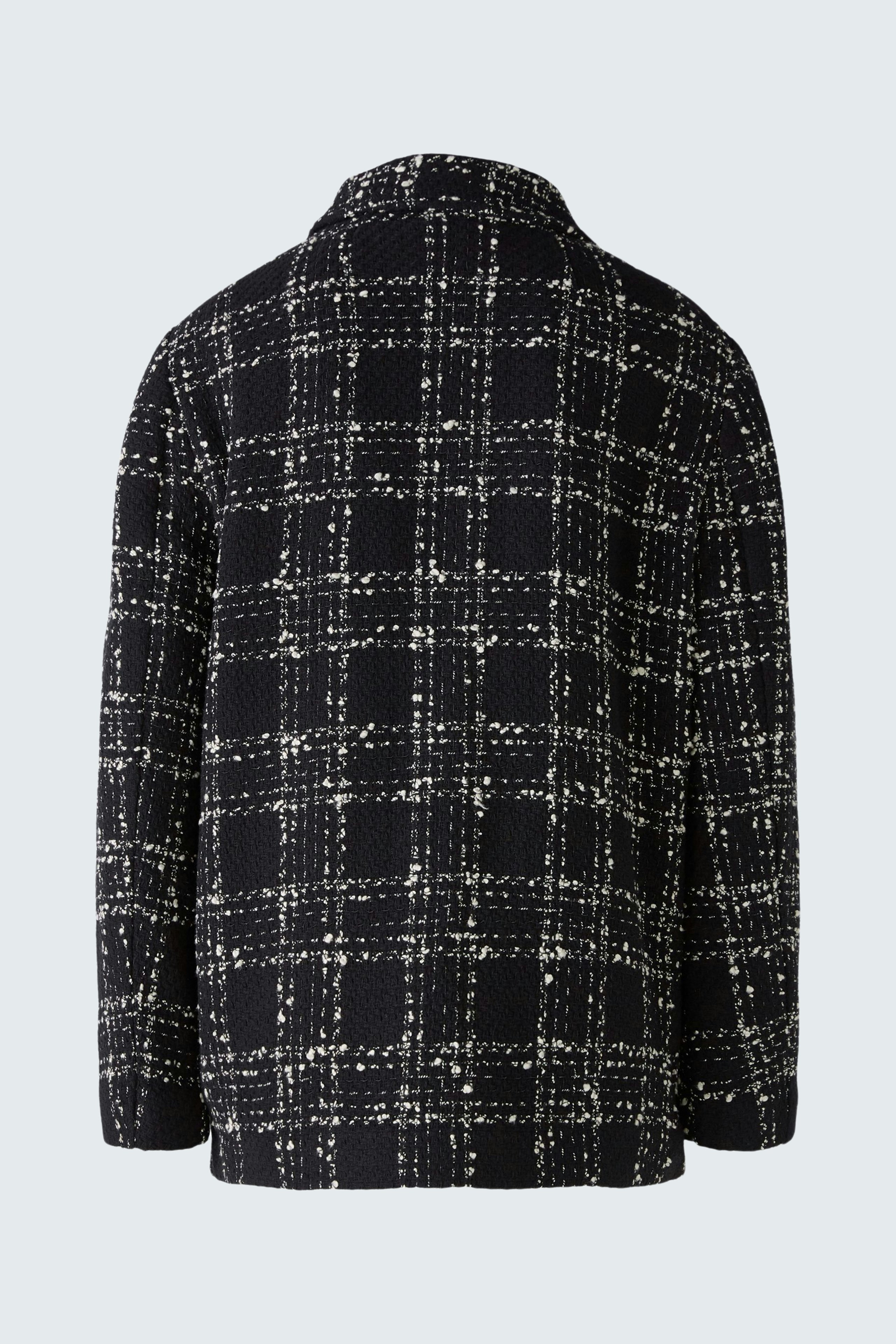 Stylish women's jacket: A black and white checked jacket with a relaxed fit, perfect for layering.