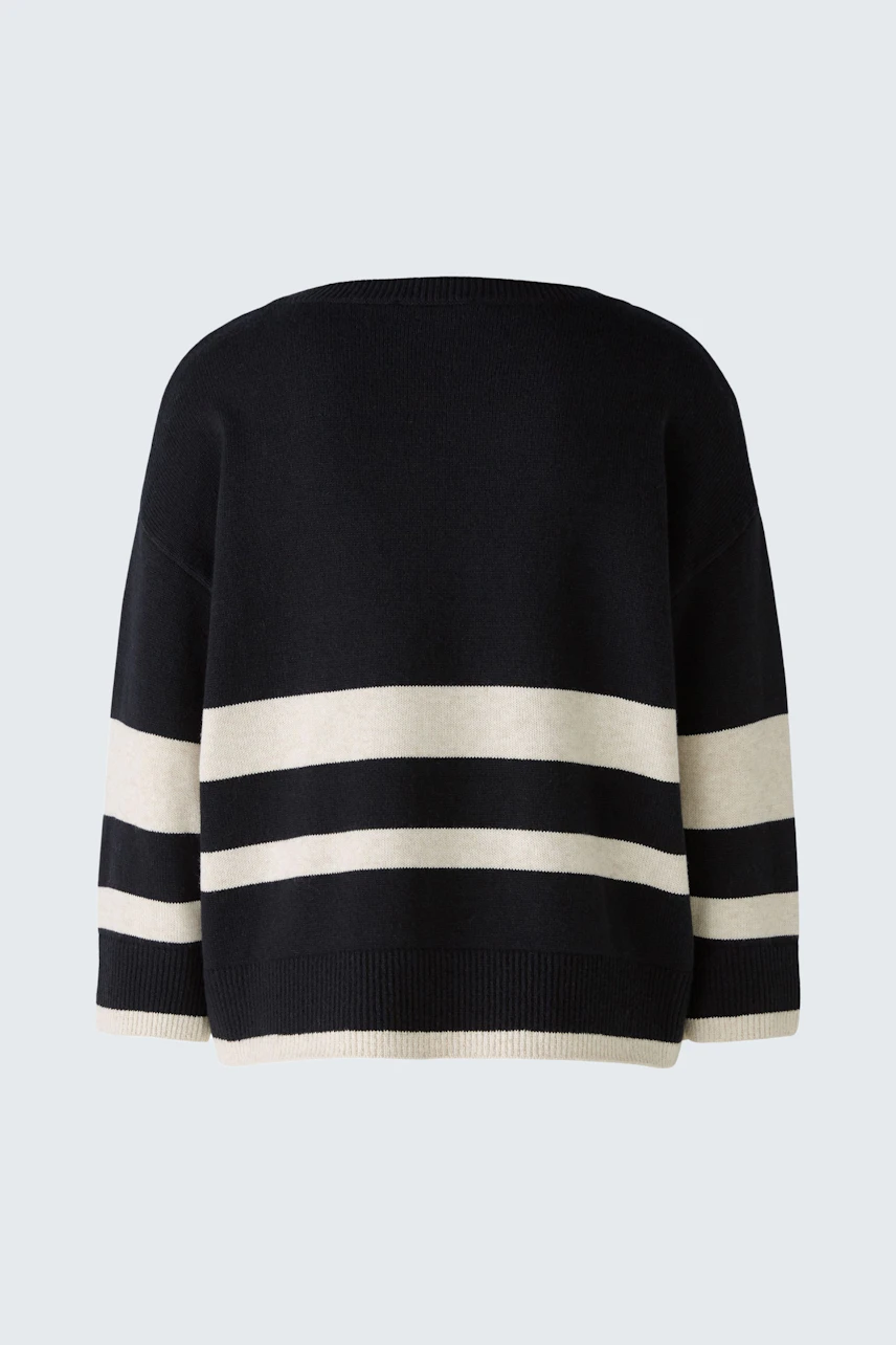 Stylish women's pullover: Black and cream striped design, perfect for casual wear.