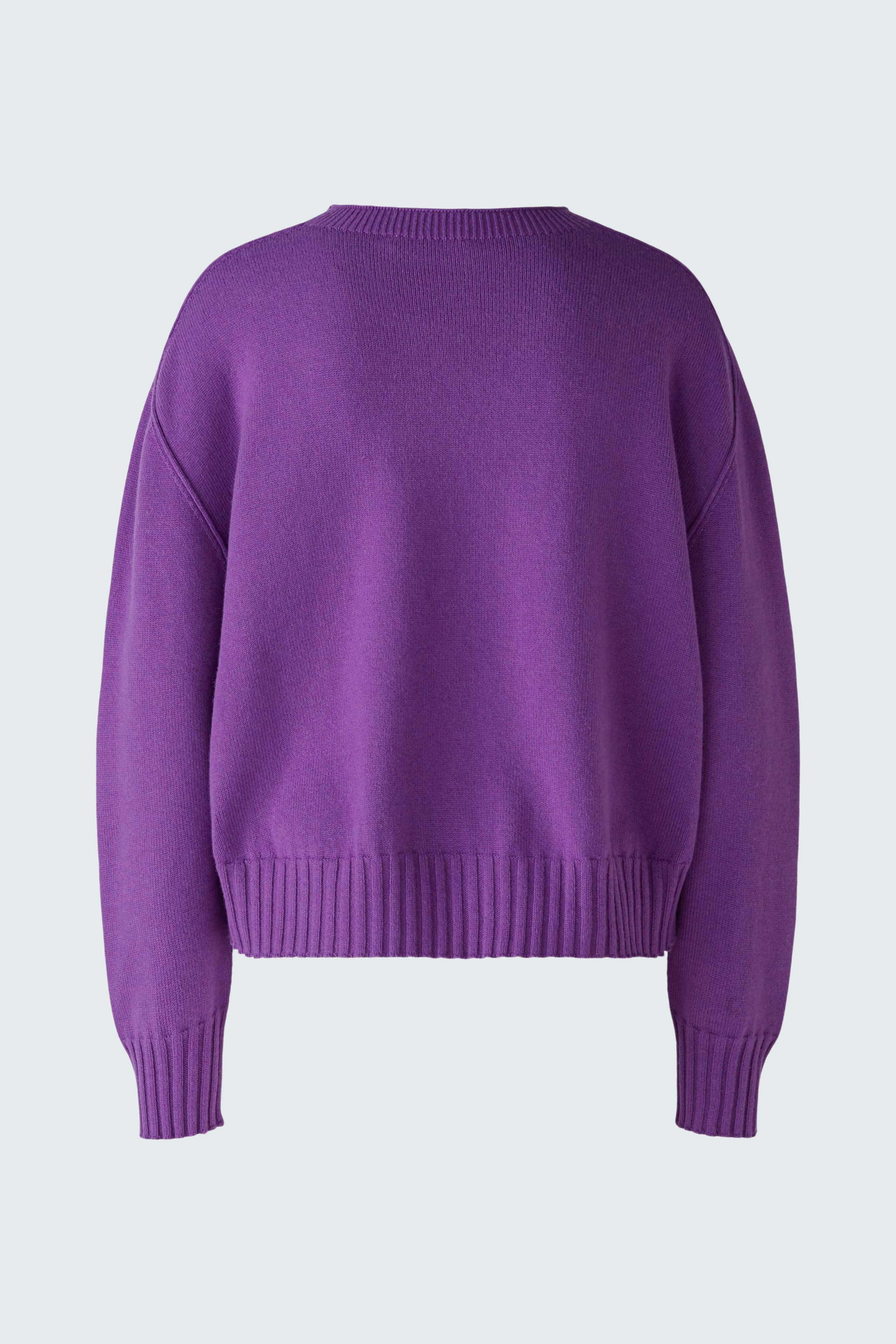 Cozy women's pullover in vibrant purple, featuring a relaxed fit and soft texture.