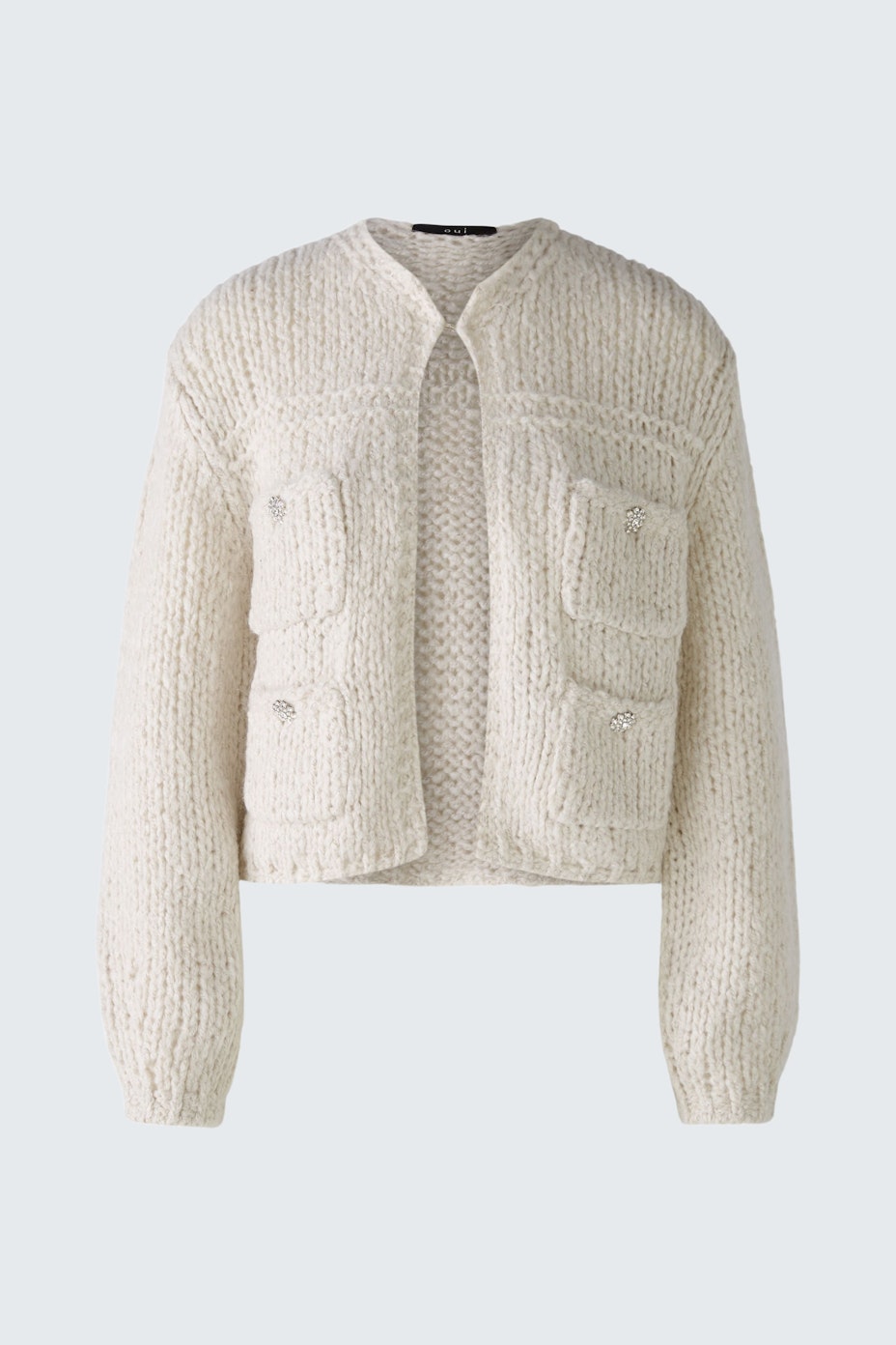 Stylish women's cardigan: Cream knitted cardigan with pockets, perfect for layering.