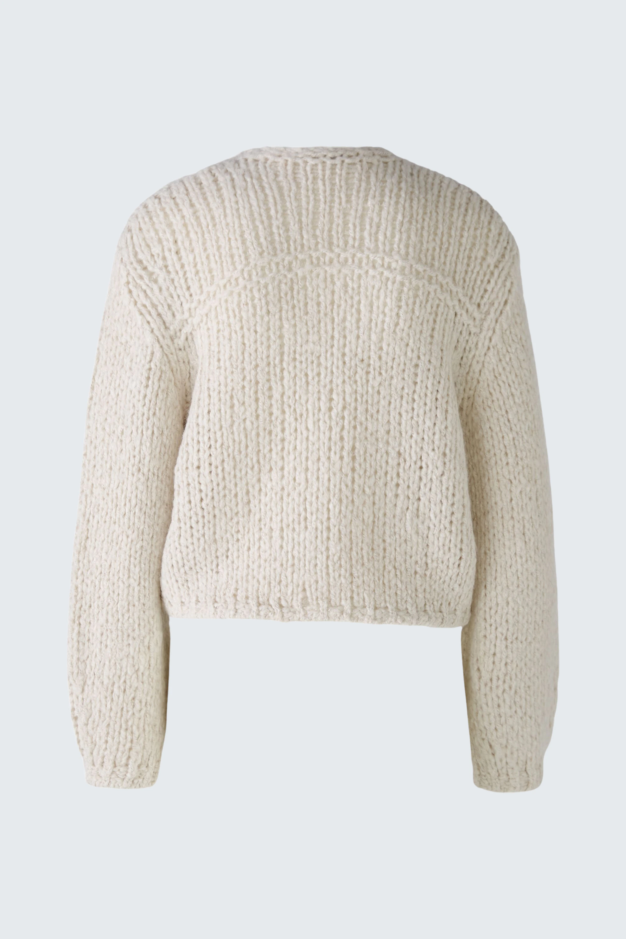 Cozy women's cardigan in soft cream, featuring a relaxed fit and textured knit design.