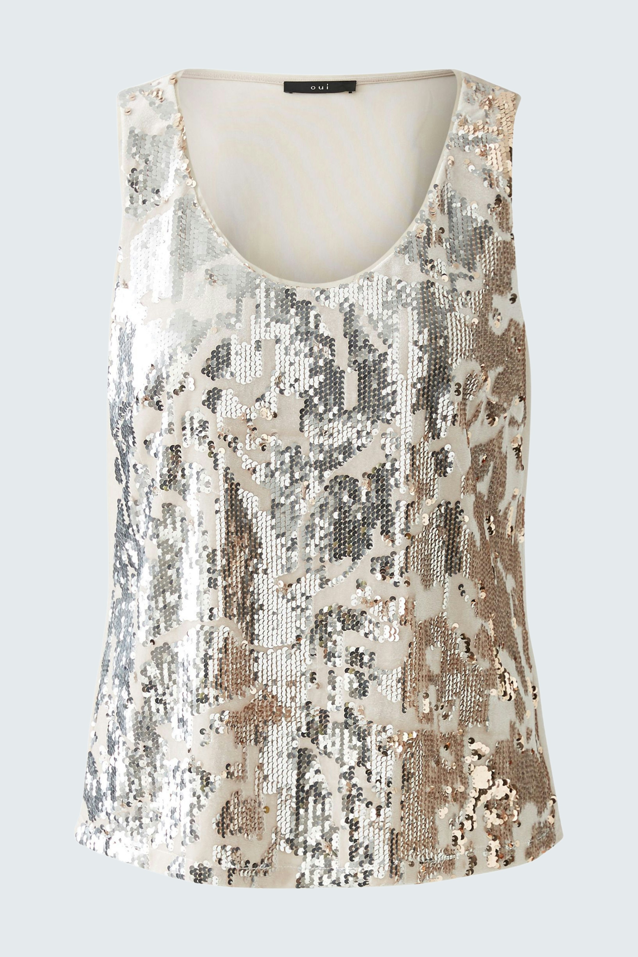 Stylish tank top: A woman in a shimmering, sequined tank top, perfect for a chic summer look.