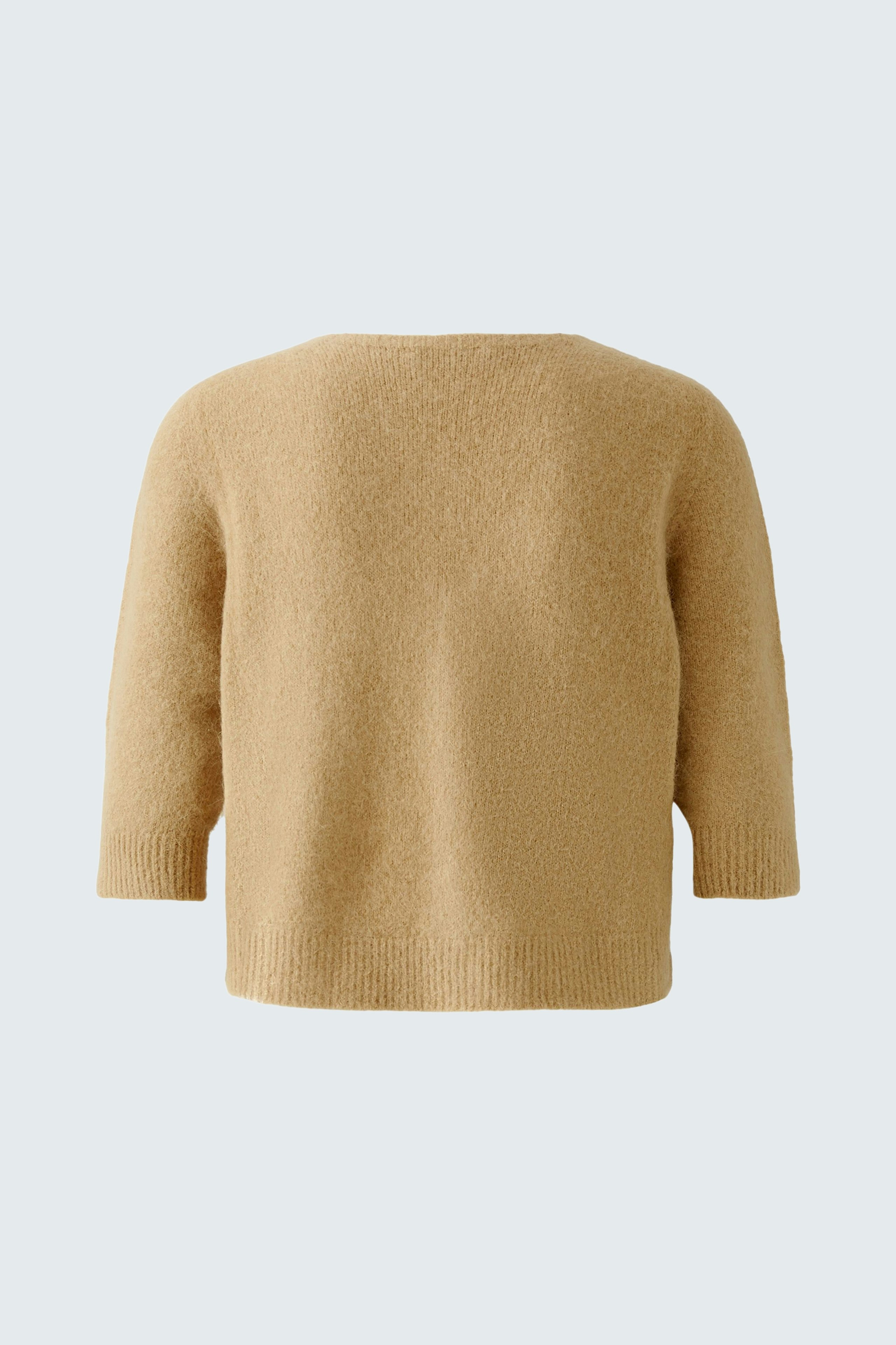 Cozy women's cardigan in soft beige, perfect for layering and casual wear.