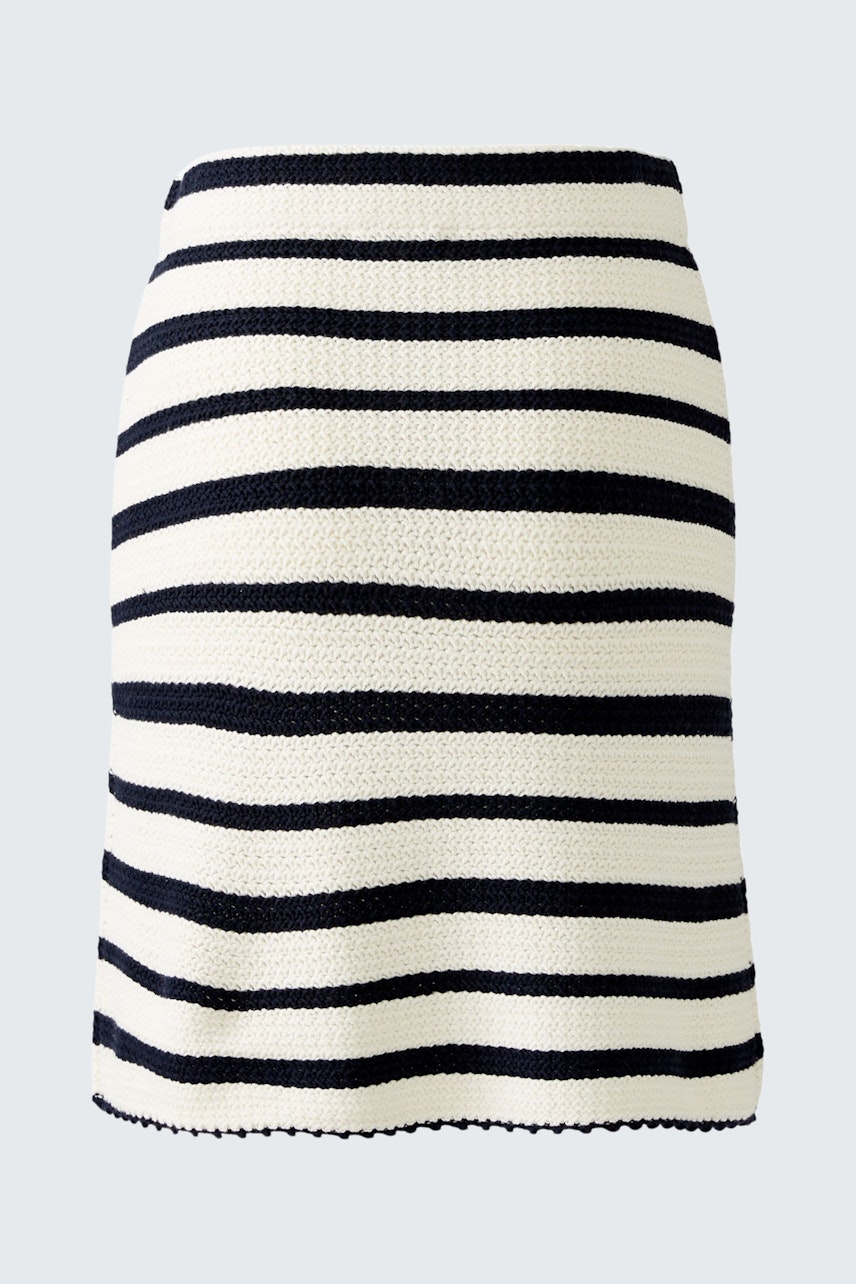 Stylish women's knitted skirt in black and white stripes, perfect for casual or dressy occasions.