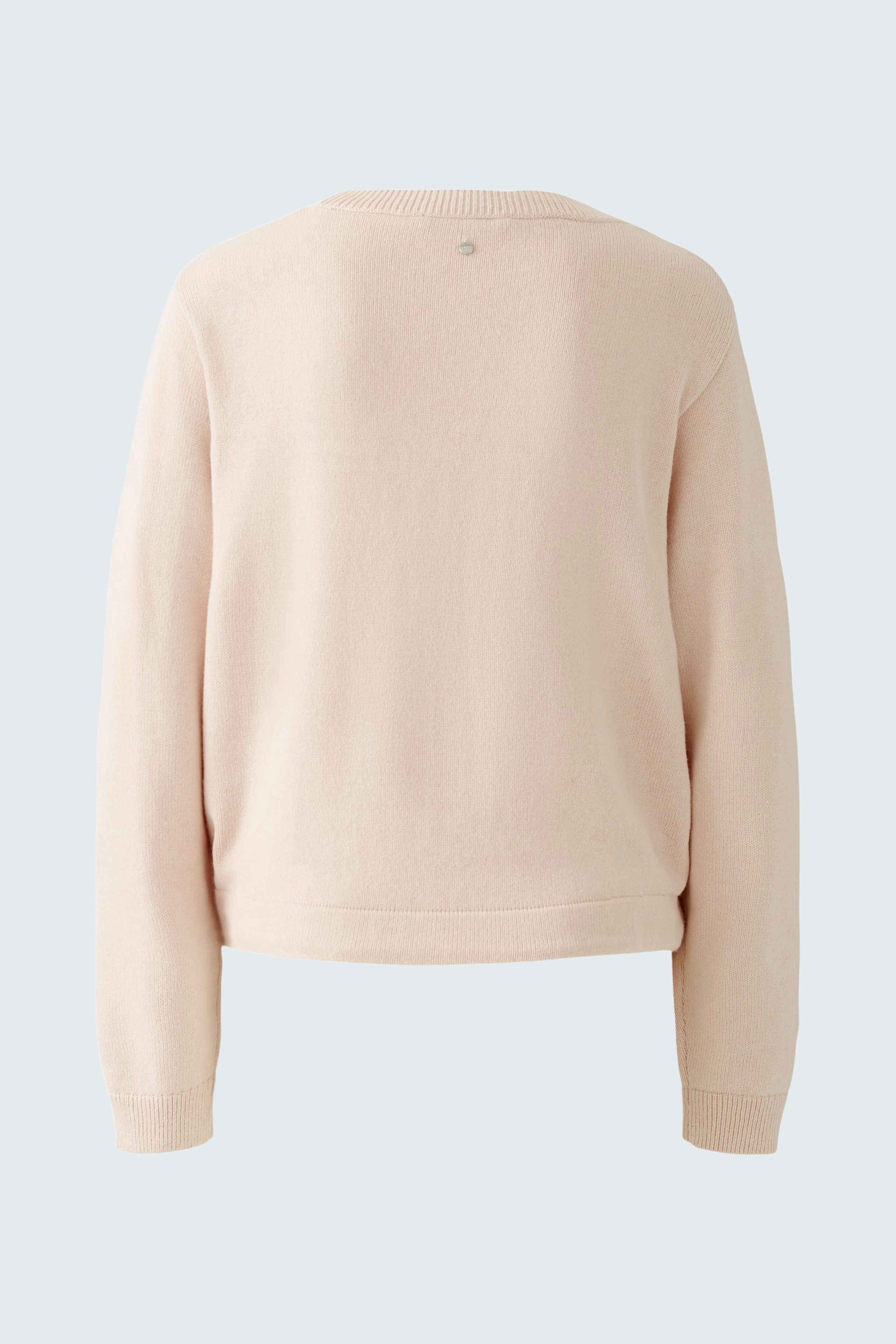 Soft pink pullover: Back view of a cozy women's pullover with a relaxed fit.