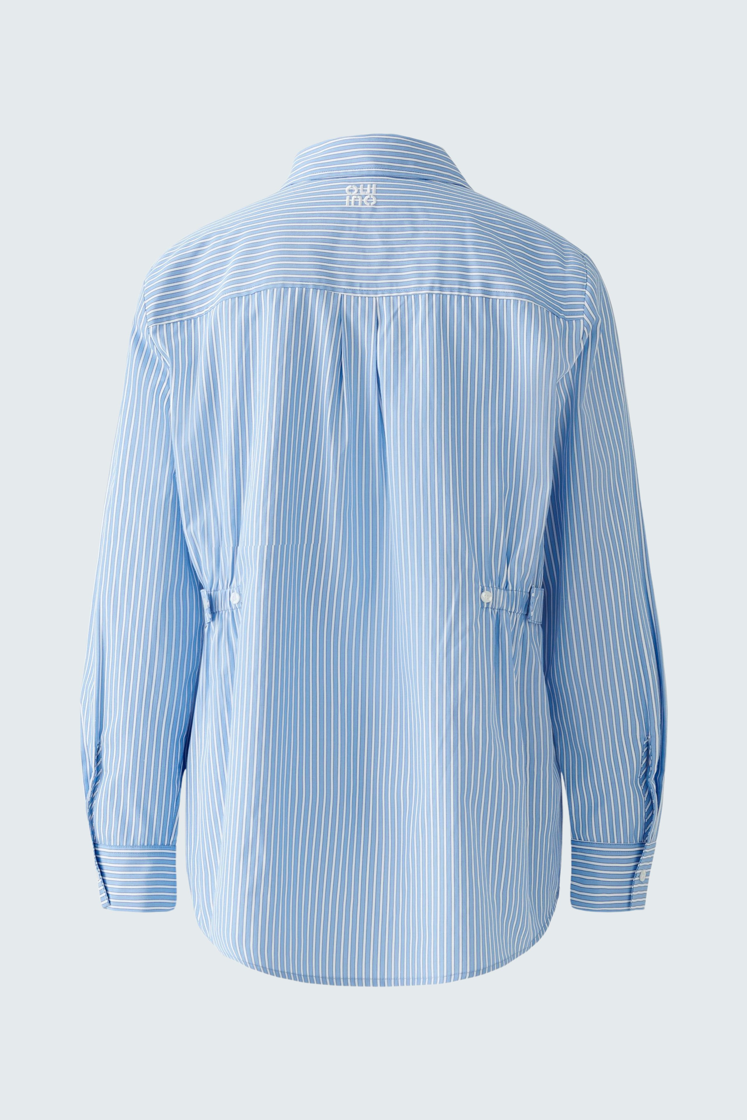 Stylish women's blouse: Light blue striped design with a relaxed fit and button details.
