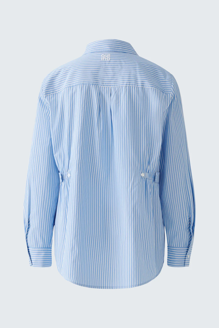 Stylish women's blouse: Light blue striped design with a relaxed fit and button details.